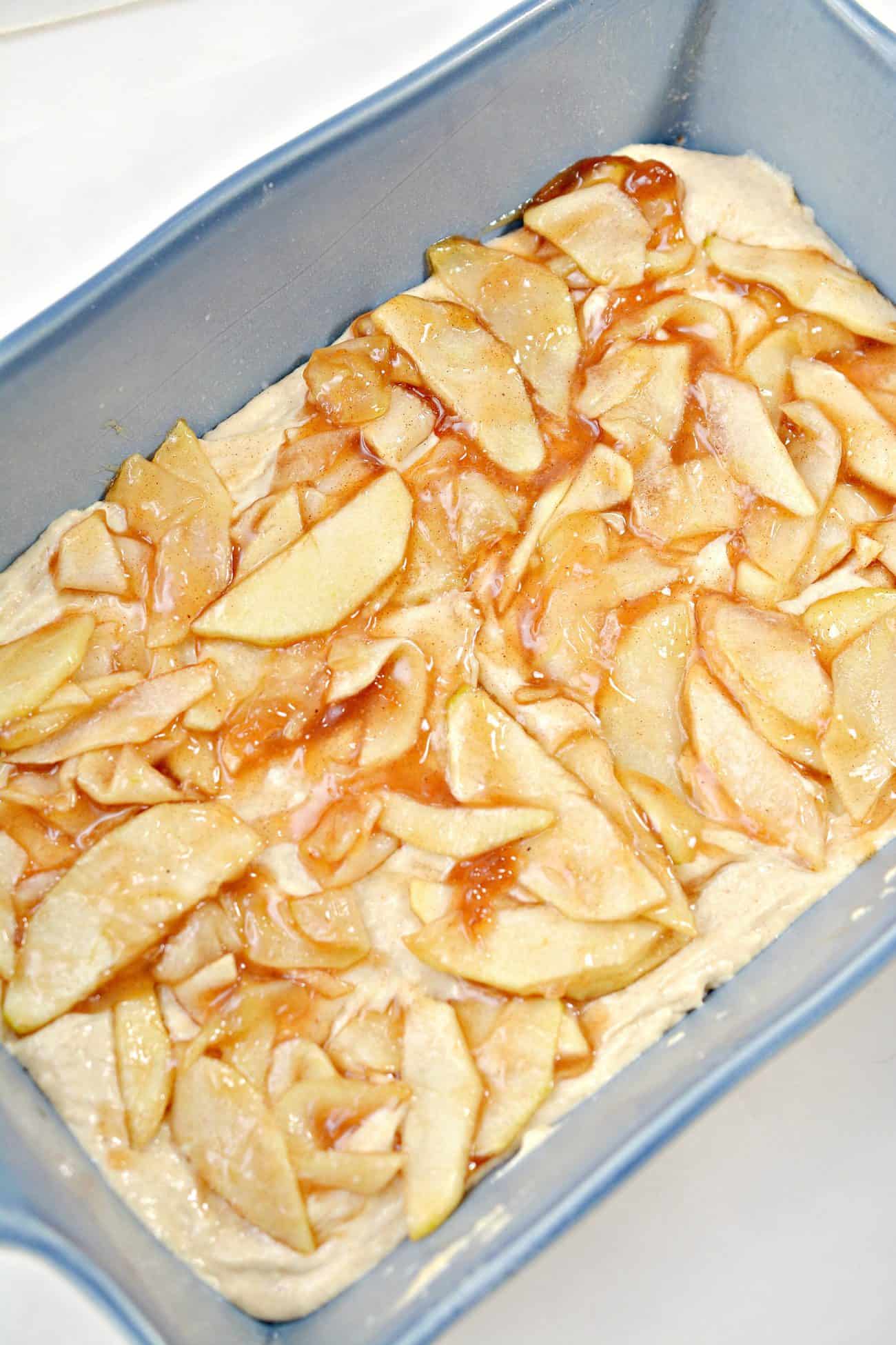 Cover the batter with the apple filling, and sprinkle ¾ of the brown sugar mixture on top of them.