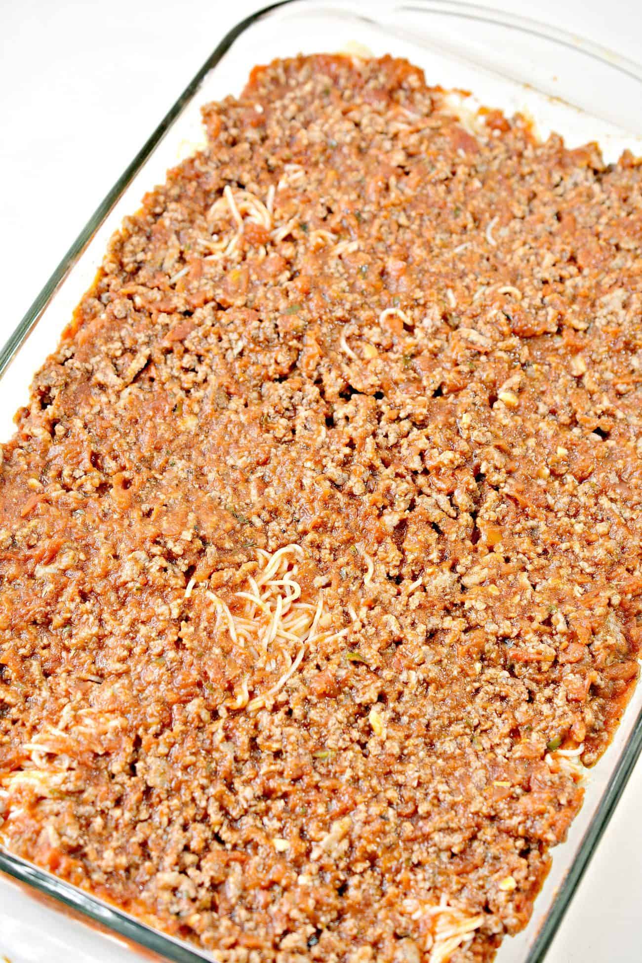Add the rest of the meat mixture on top of the spaghetti.