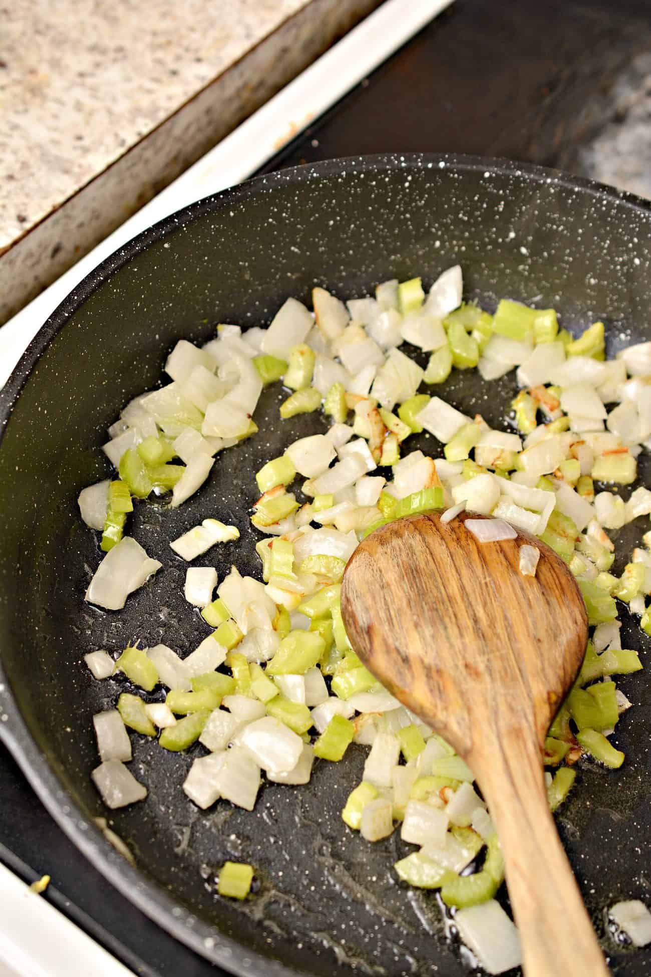 Add the butter, onions, and celery to a skillet and saute until the vegetables have begun to soften