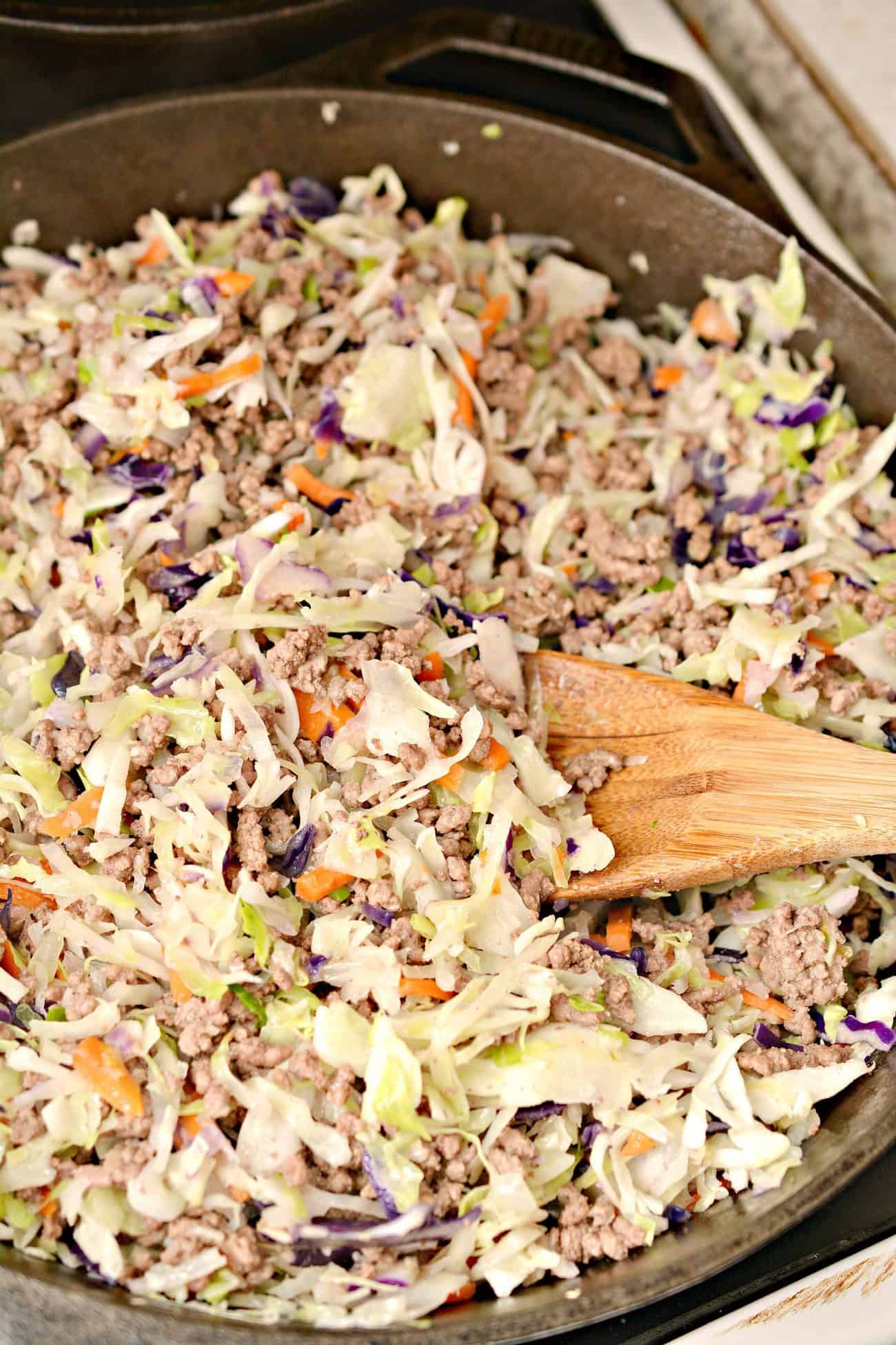 mixing coleslaw and cabbage