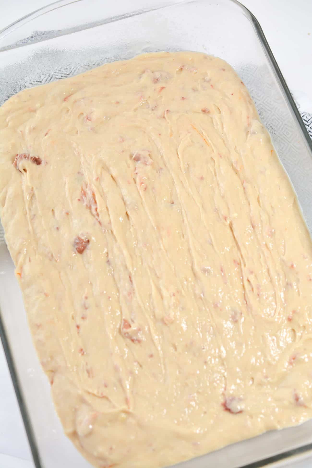 Spread the mixture into an even layer in the bottom of a well-greased 9x13 baking dish.