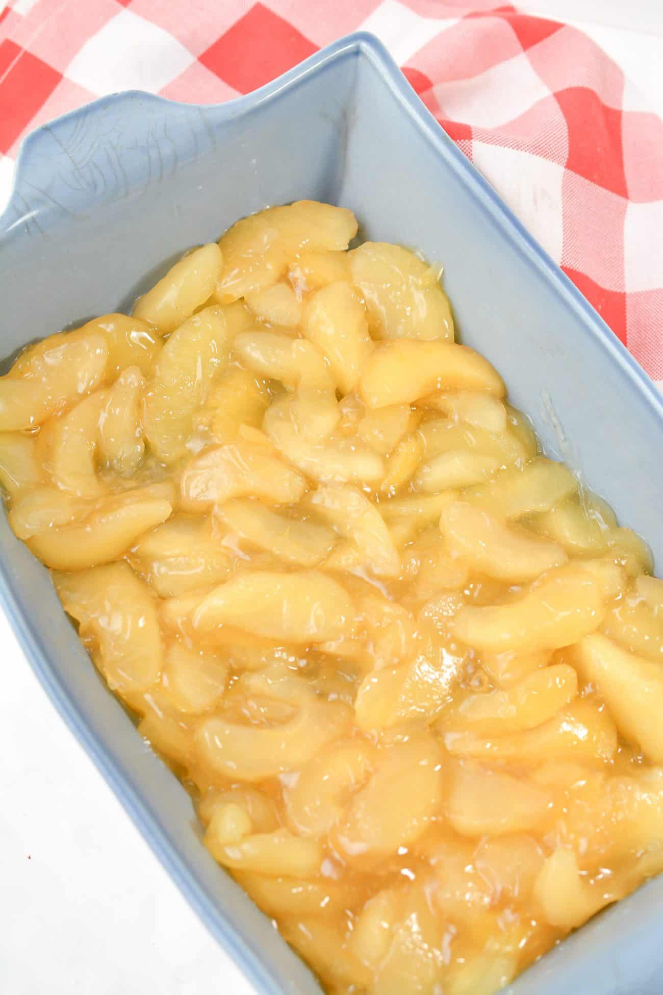 Add the apple pie filling in an even layer to the baking dish.