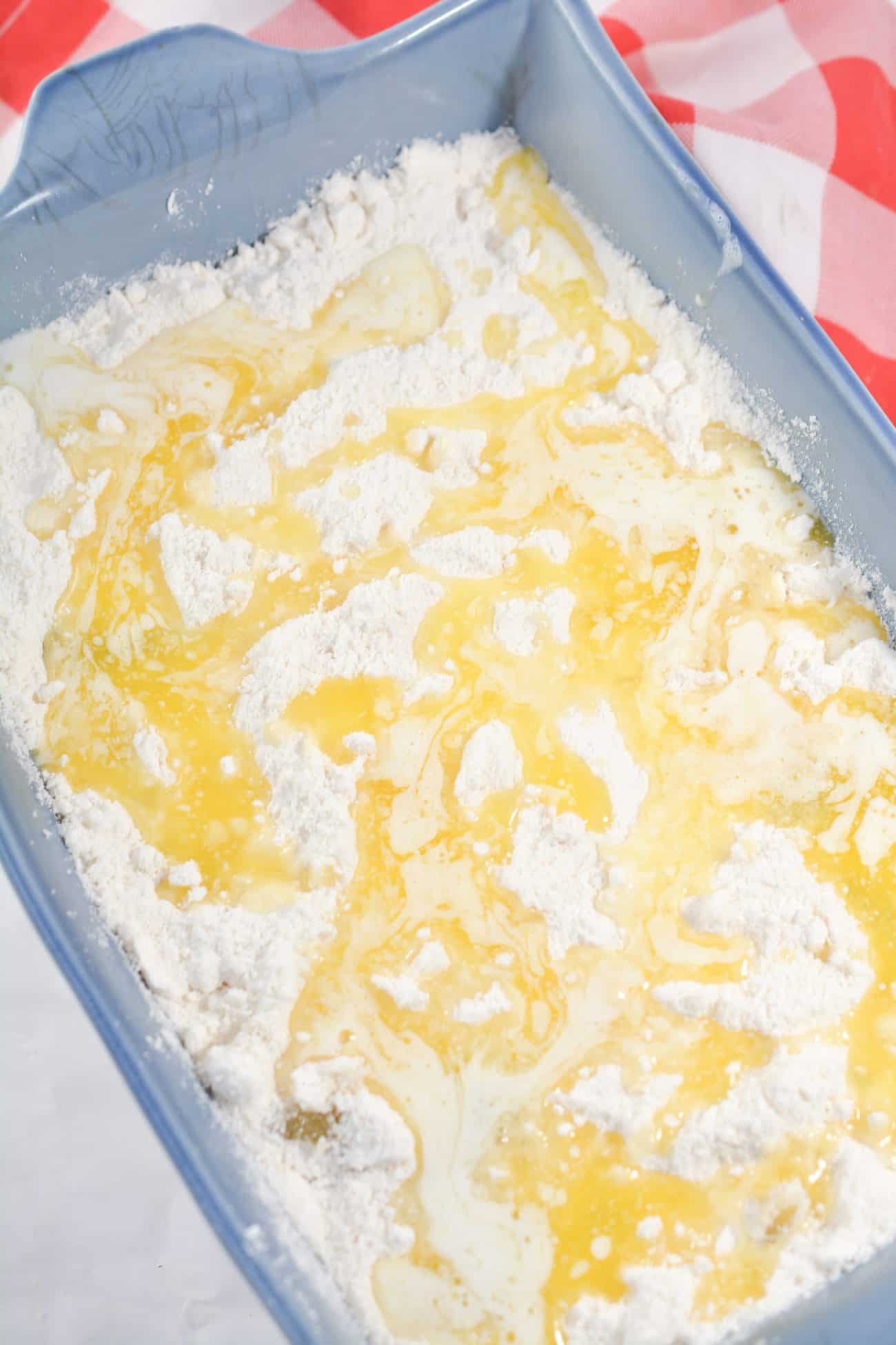 Drizzle the butter over the top of the cake mix.