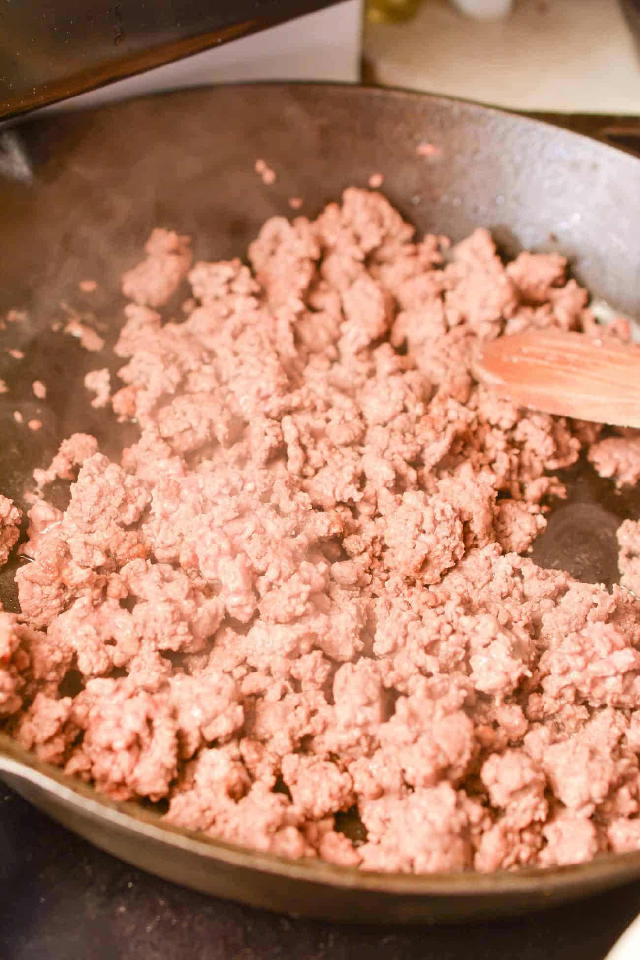 Brown the ground beef in a skillet