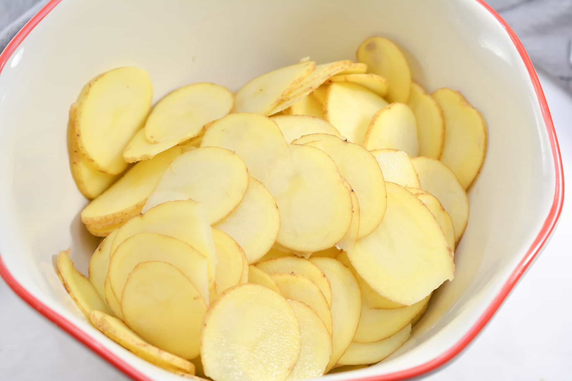 Add the sliced potatoes to a bowl