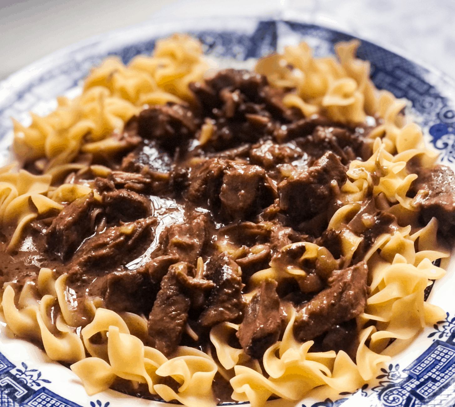 The Coziest, Creamiest Beef Tips with Egg Noodles image