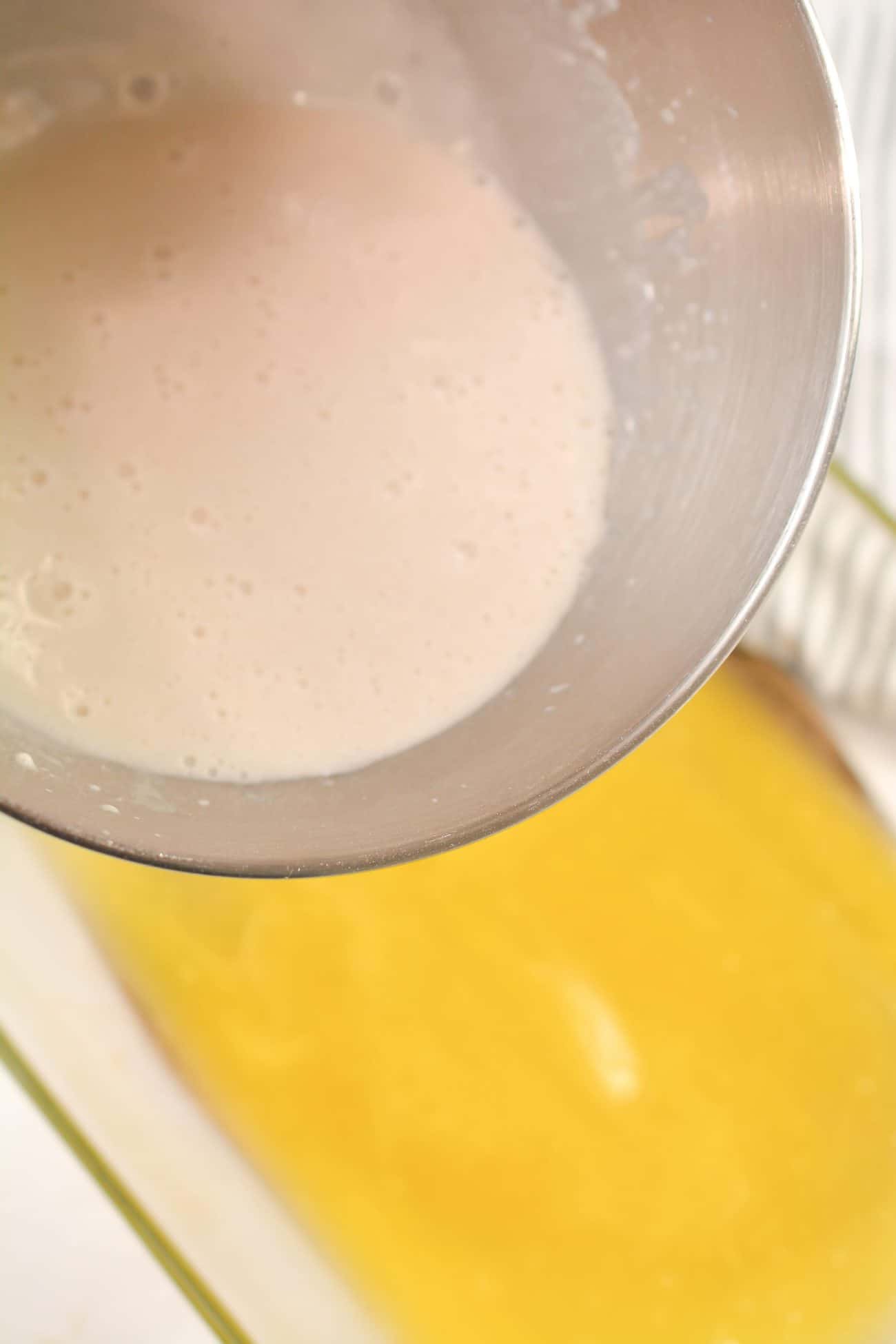 Pour the batter mixture over the butter or margarine
