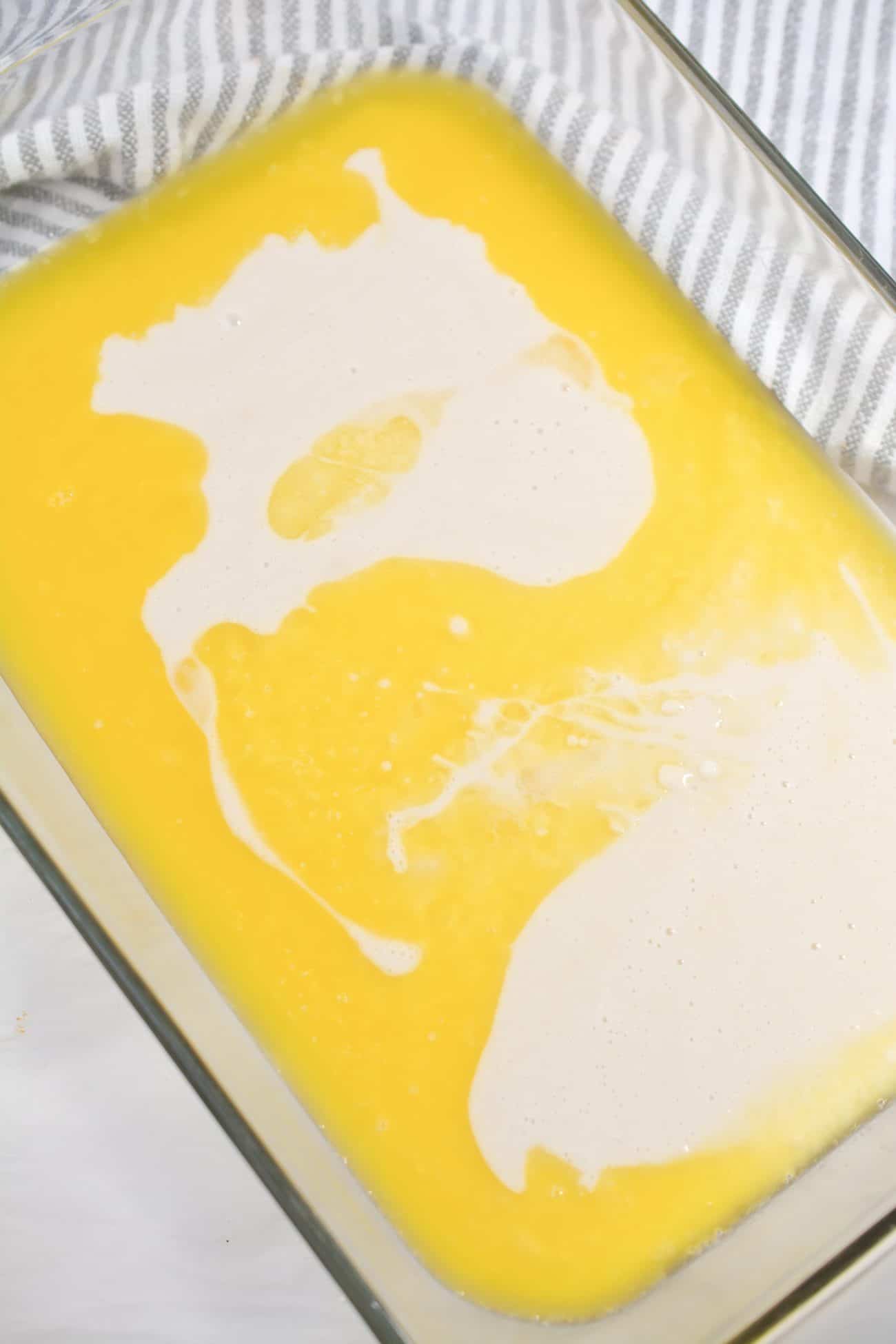 Pour the batter mixture over the butter or margarine