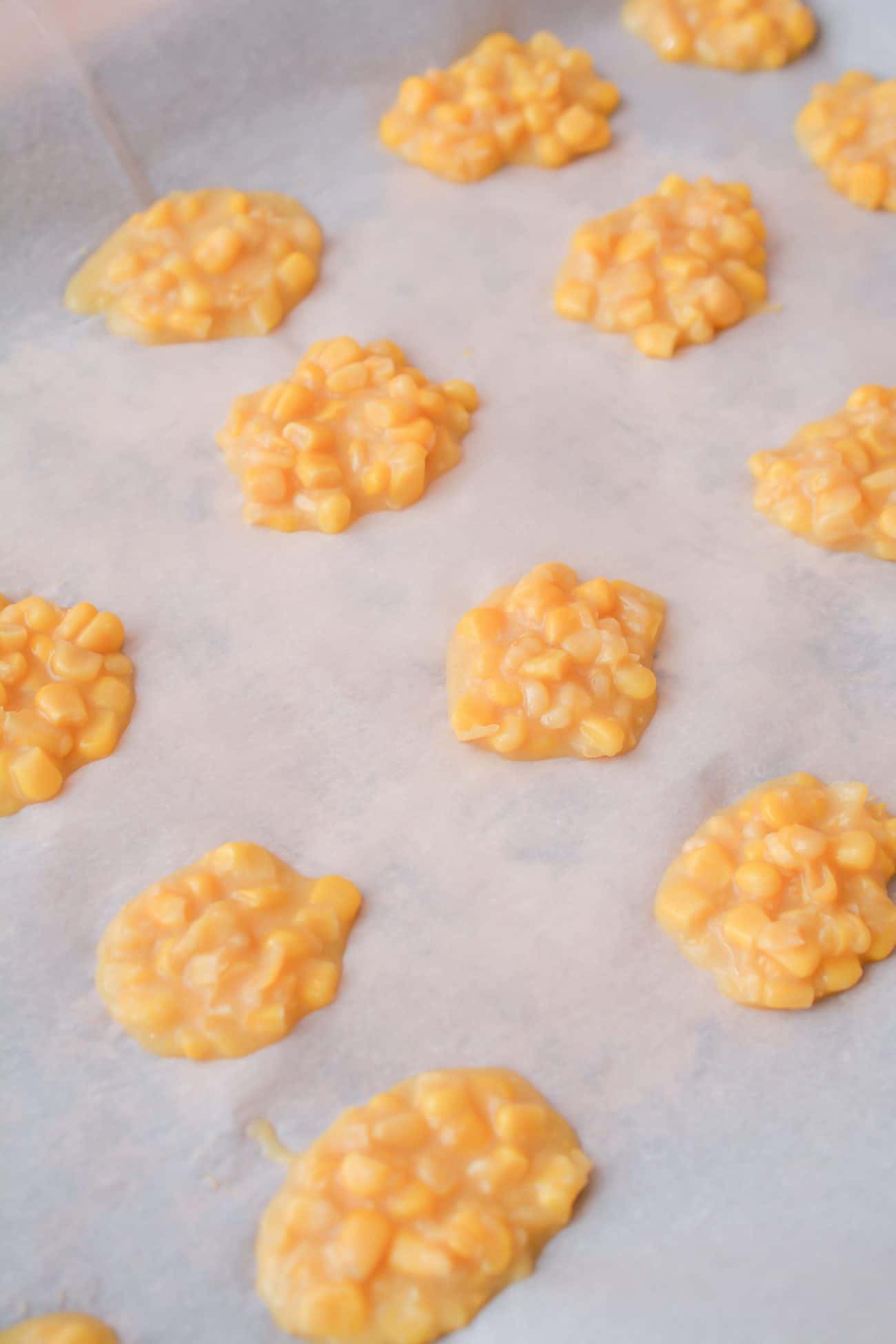 Place spoonfuls of the corn mixture onto a large parchment-lined baking sheet and freeze for 3-4 hours.