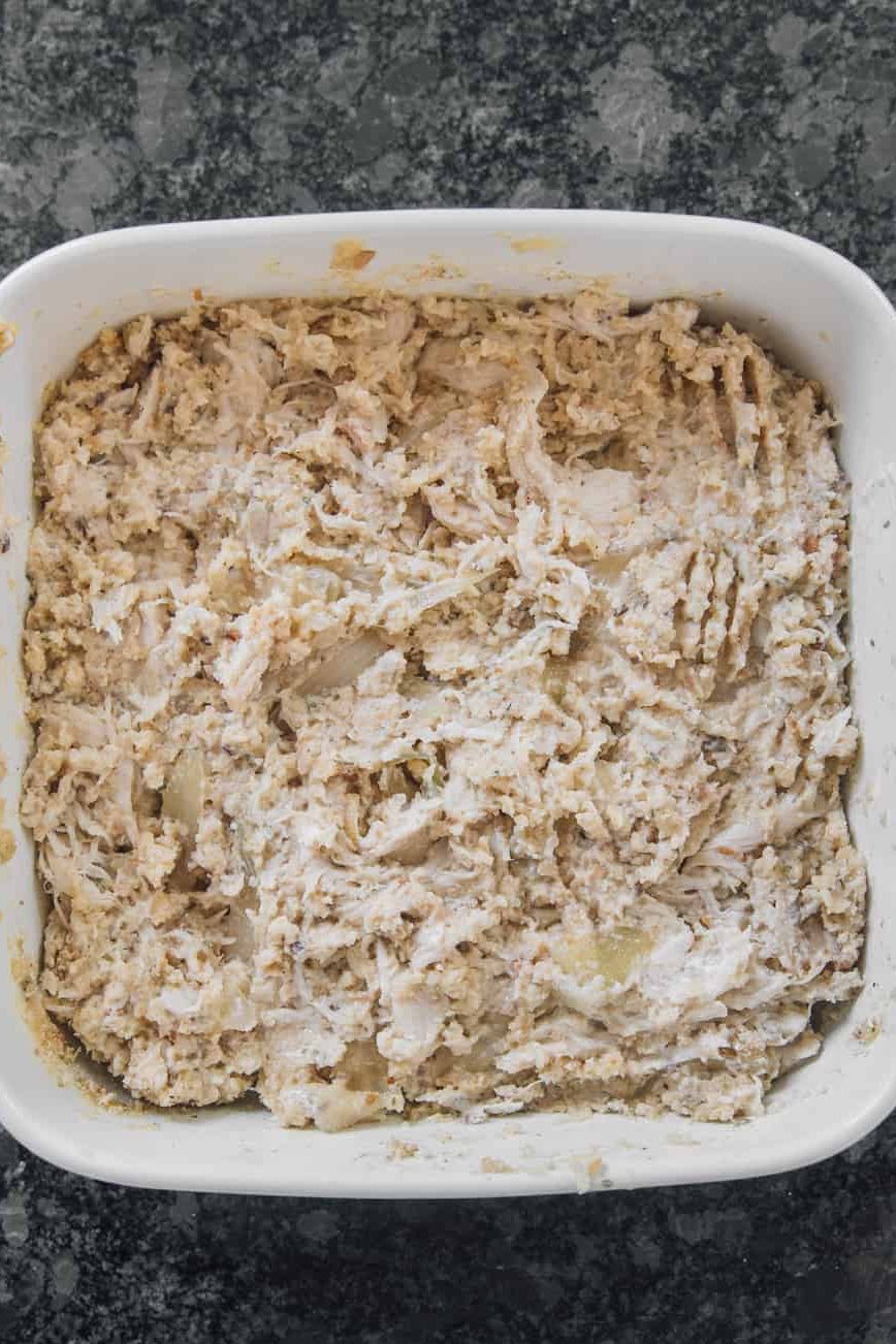 Place the shredded chicken on the casserole with the mixture for the filling, and if you use broccoli, place it on top.
