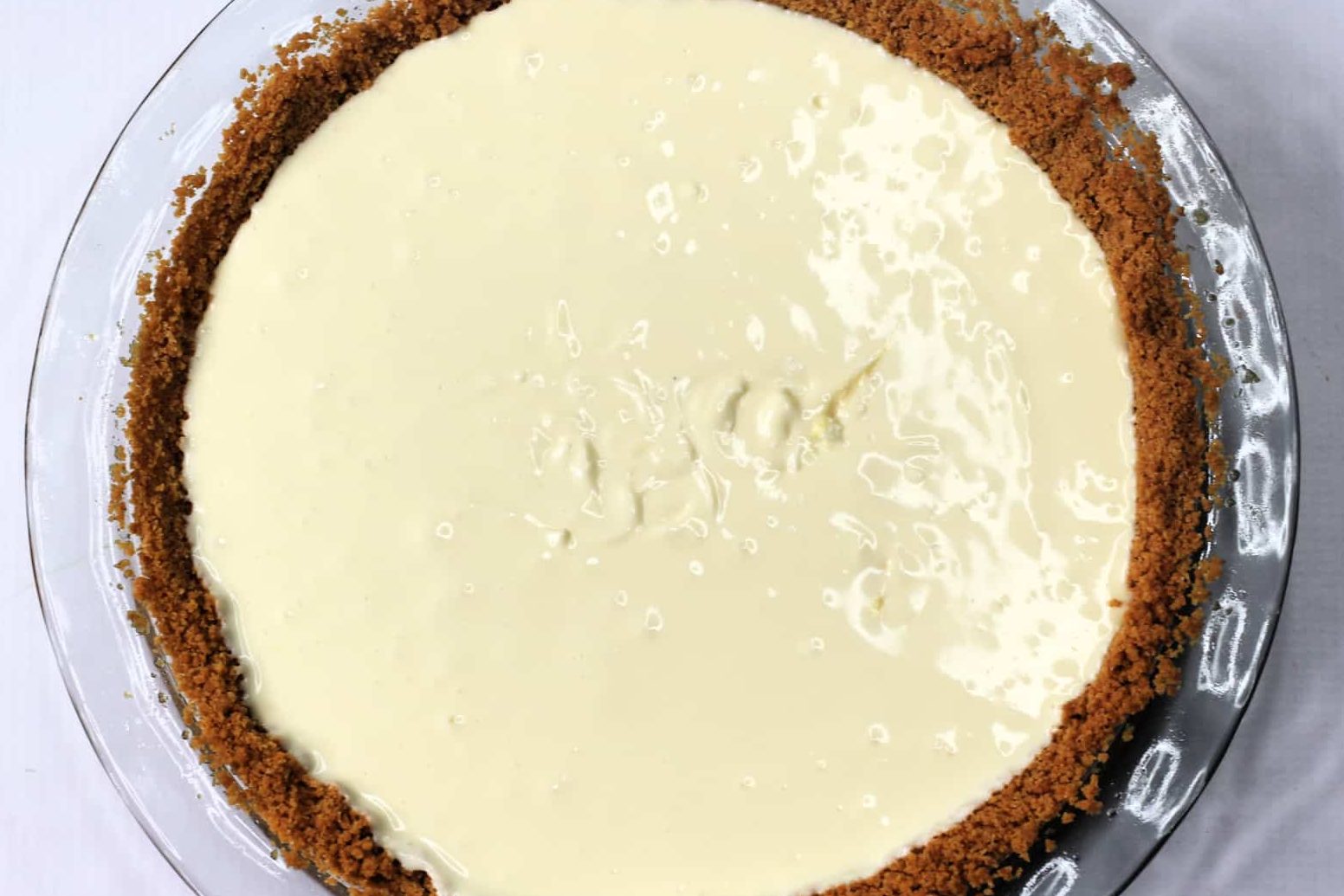 Pour the mixture into the crust and place into the fridge for 4-6 hours or until firm