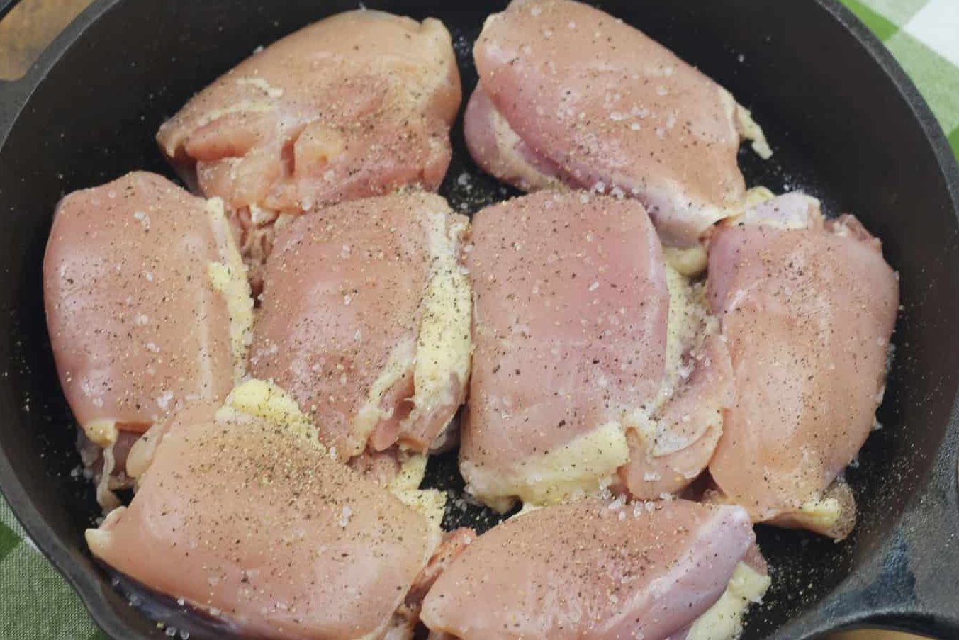 Using a cast iron, place the chicken into the cast iron.