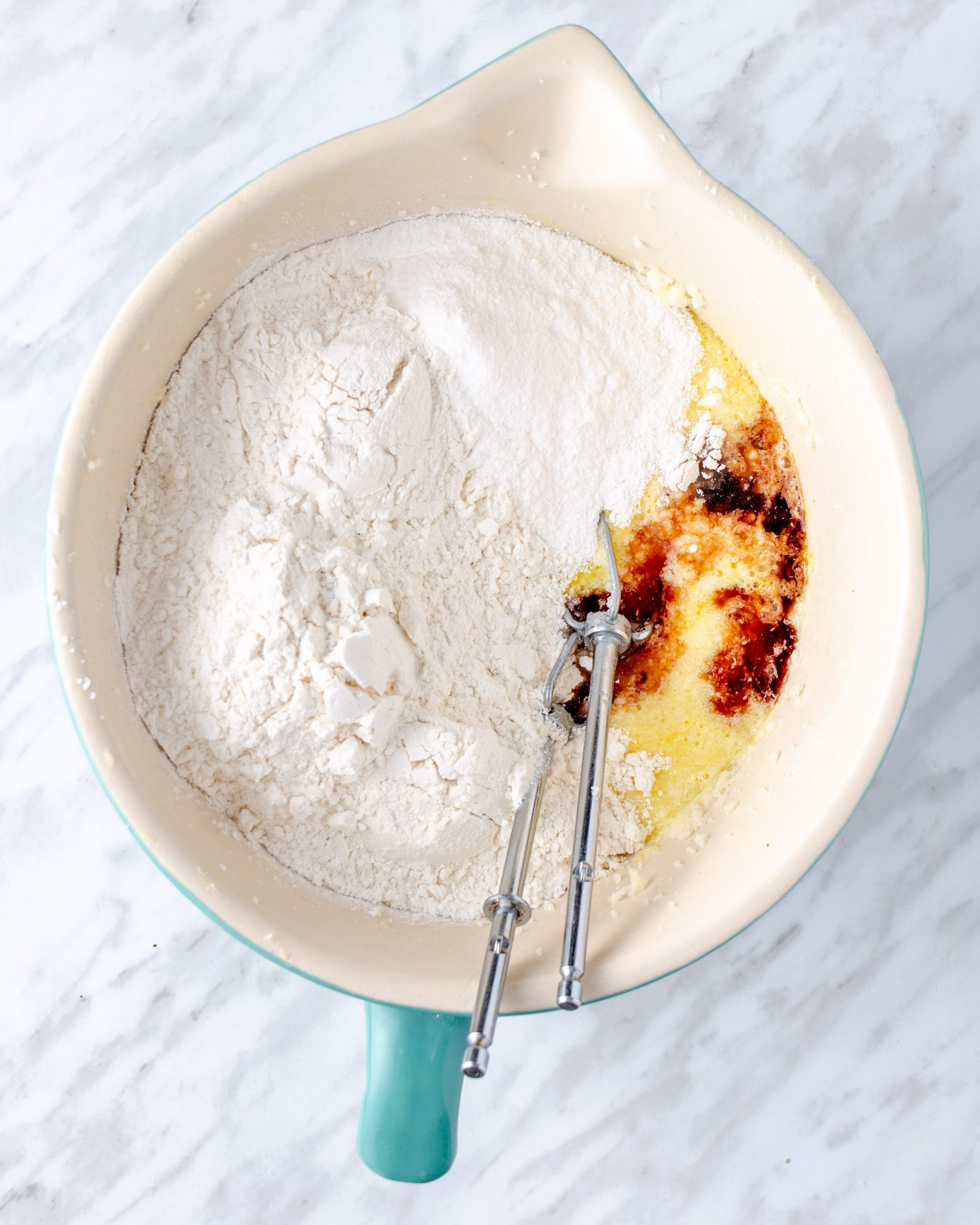 Place the flour, baking powder, banana pudding mix, and vanilla in the mixing bowl and beat until smooth.