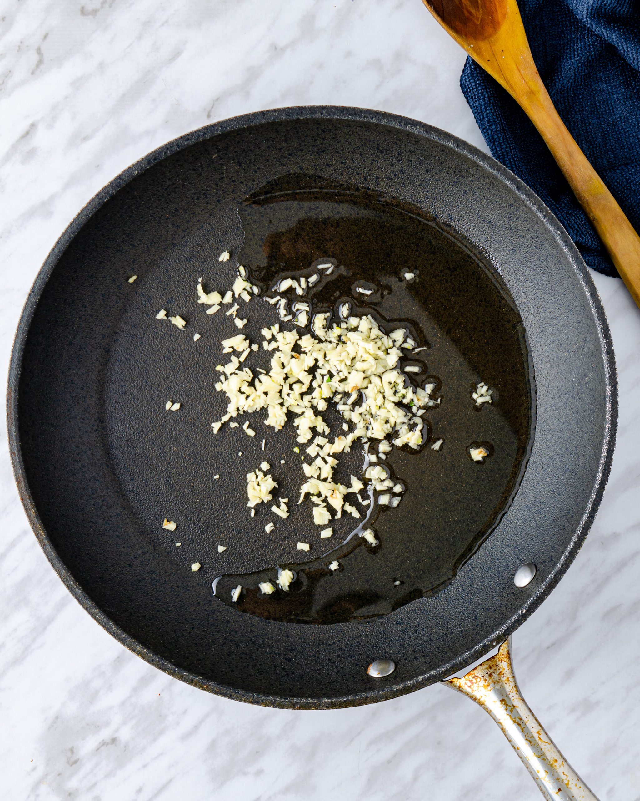 Saute your garlic for about 5 seconds, then add ground beef to the pan