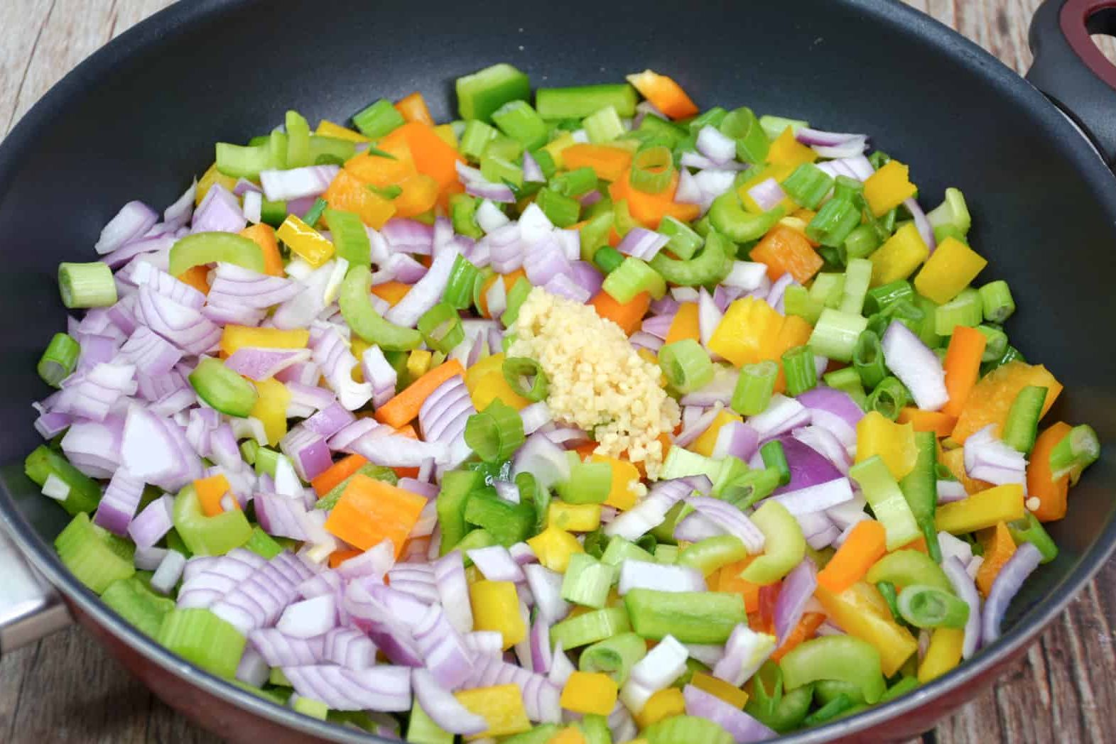 Add the onions, peppers, minced, garlic and celery to the saute pan.