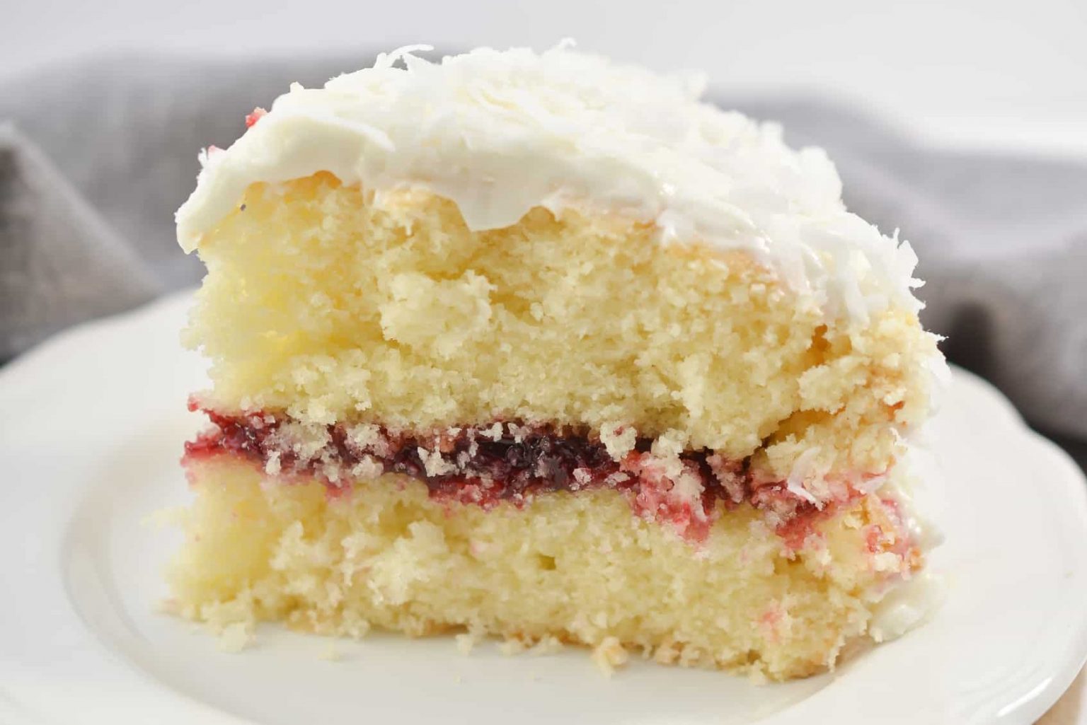 Coconut Cake with Raspberry Filling - Sweet Pea's Kitchen