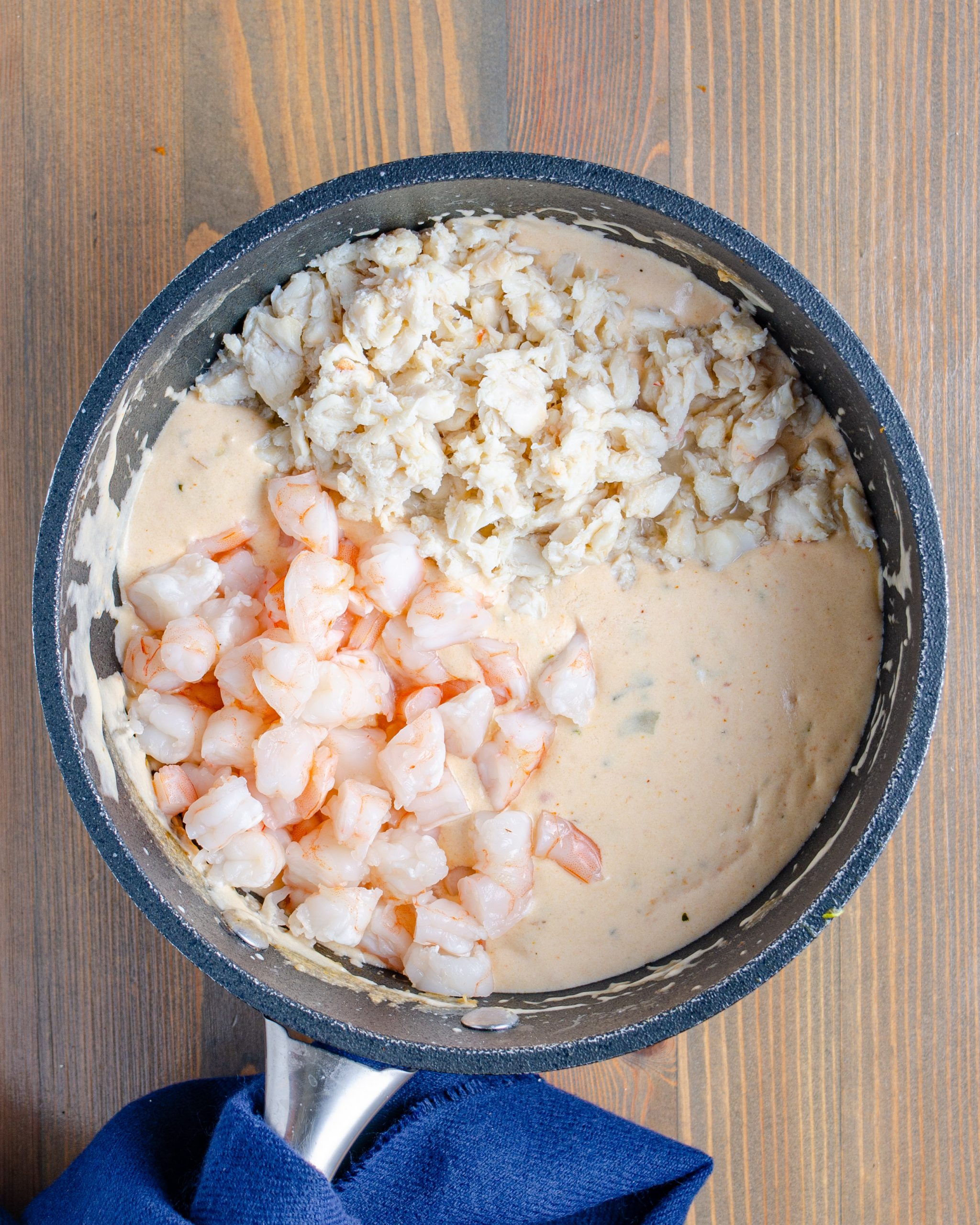 Stir in the shrimp and the crab meat.
