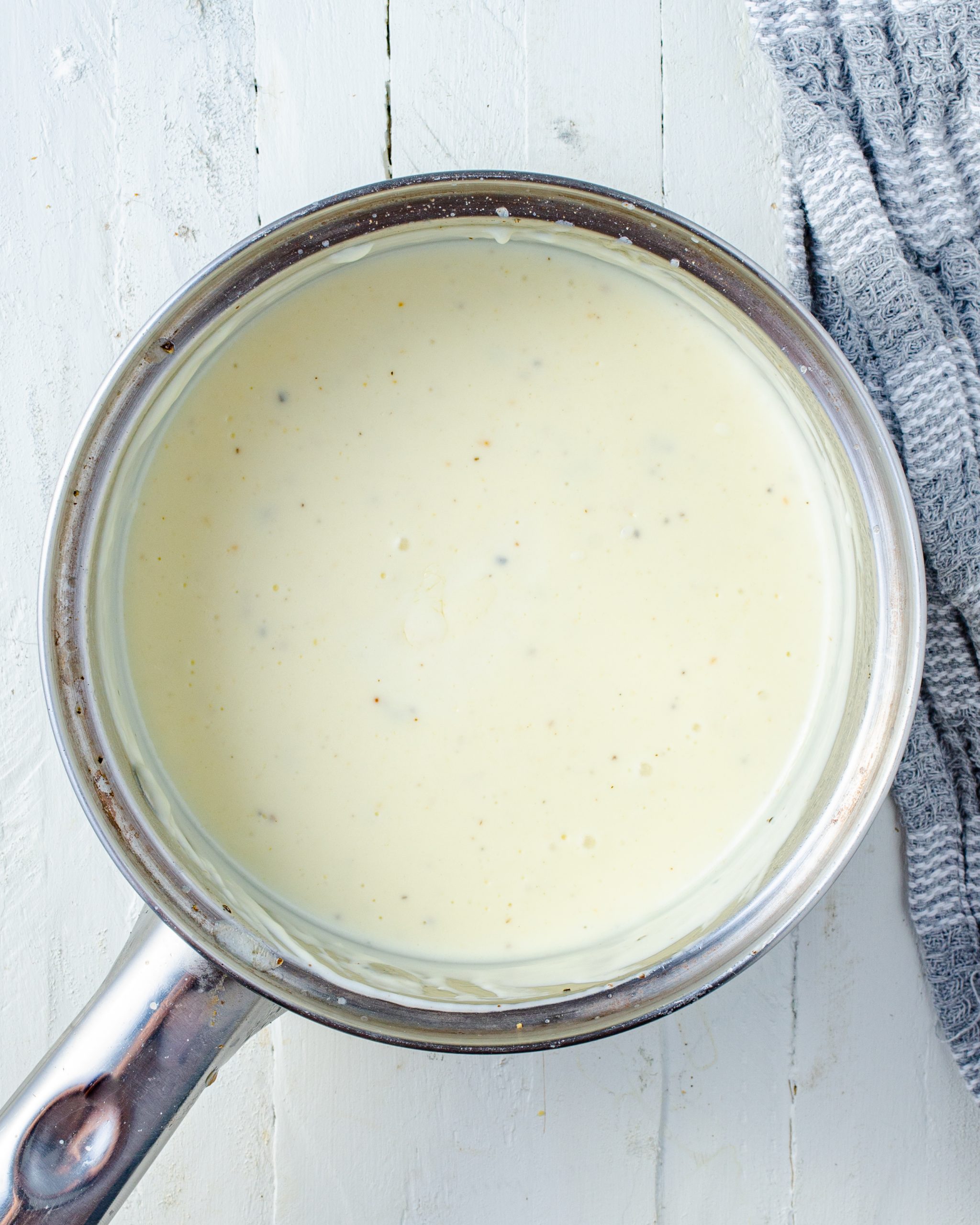 Bring the mixture to a rolling simmer over medium heat, and whisk often to prevent burning.