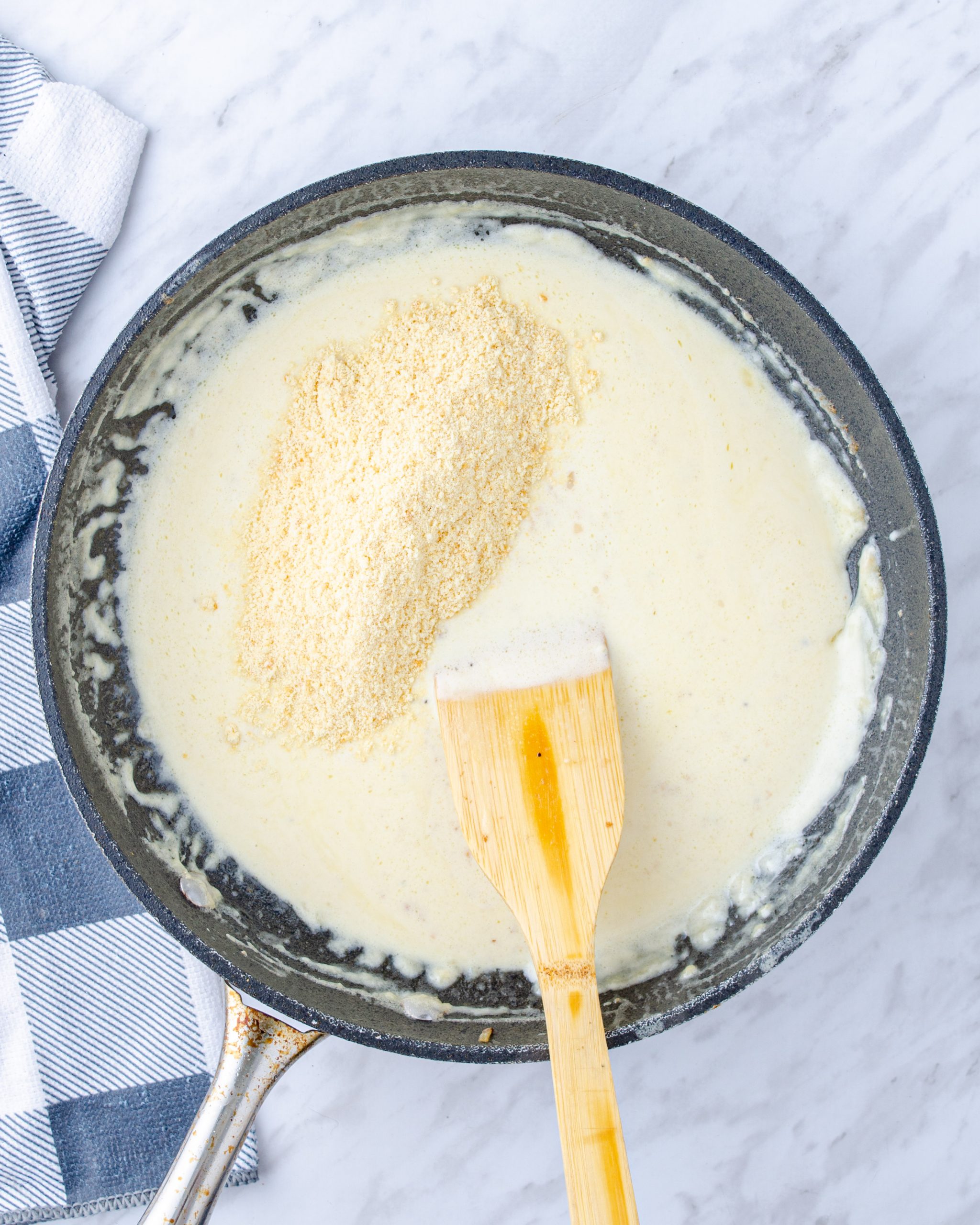 Stir the parmesan cheese into the sauce, and add the shrimp back to the skillet.