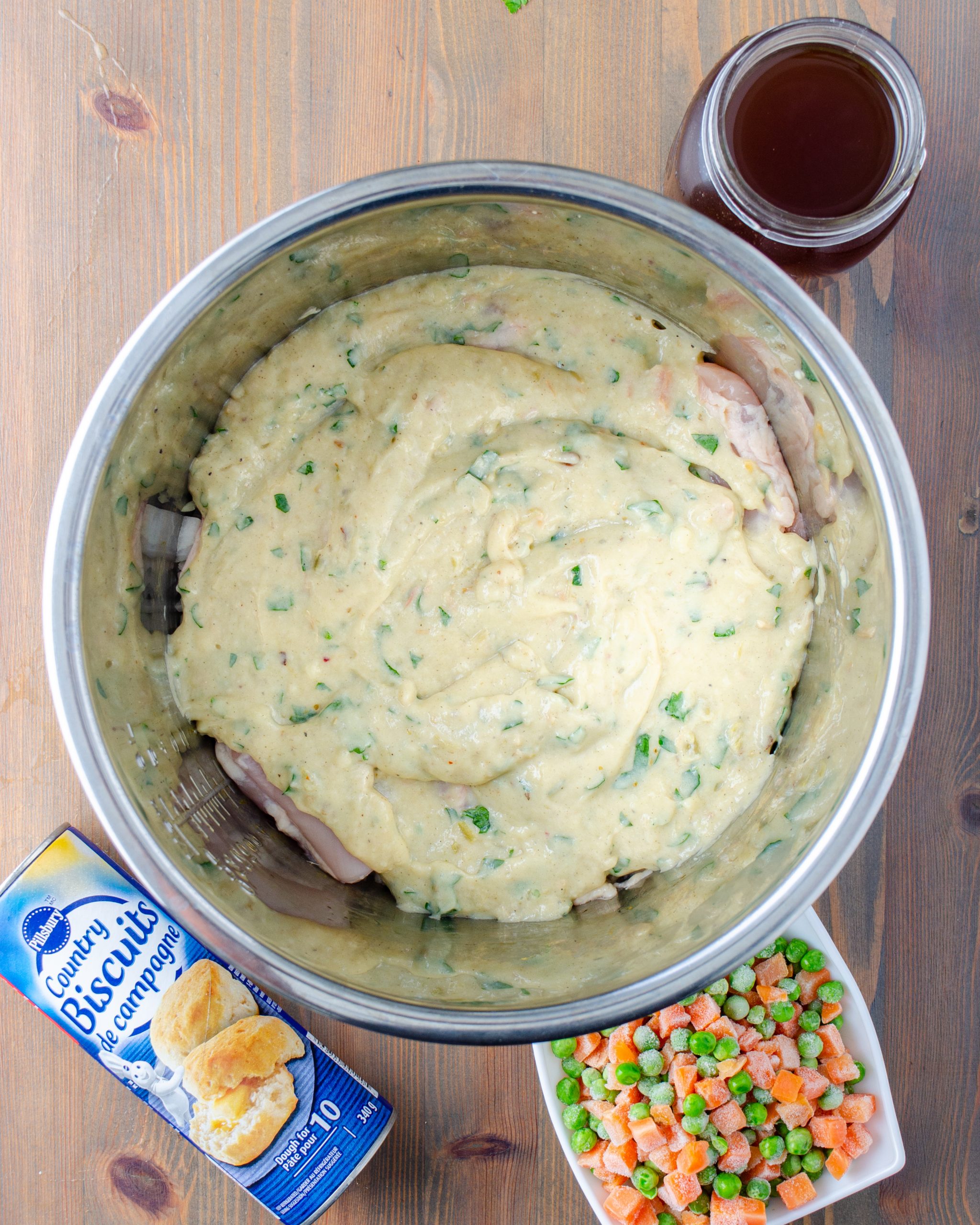 Pour the soup mixture over the chicken in the slow cooker.