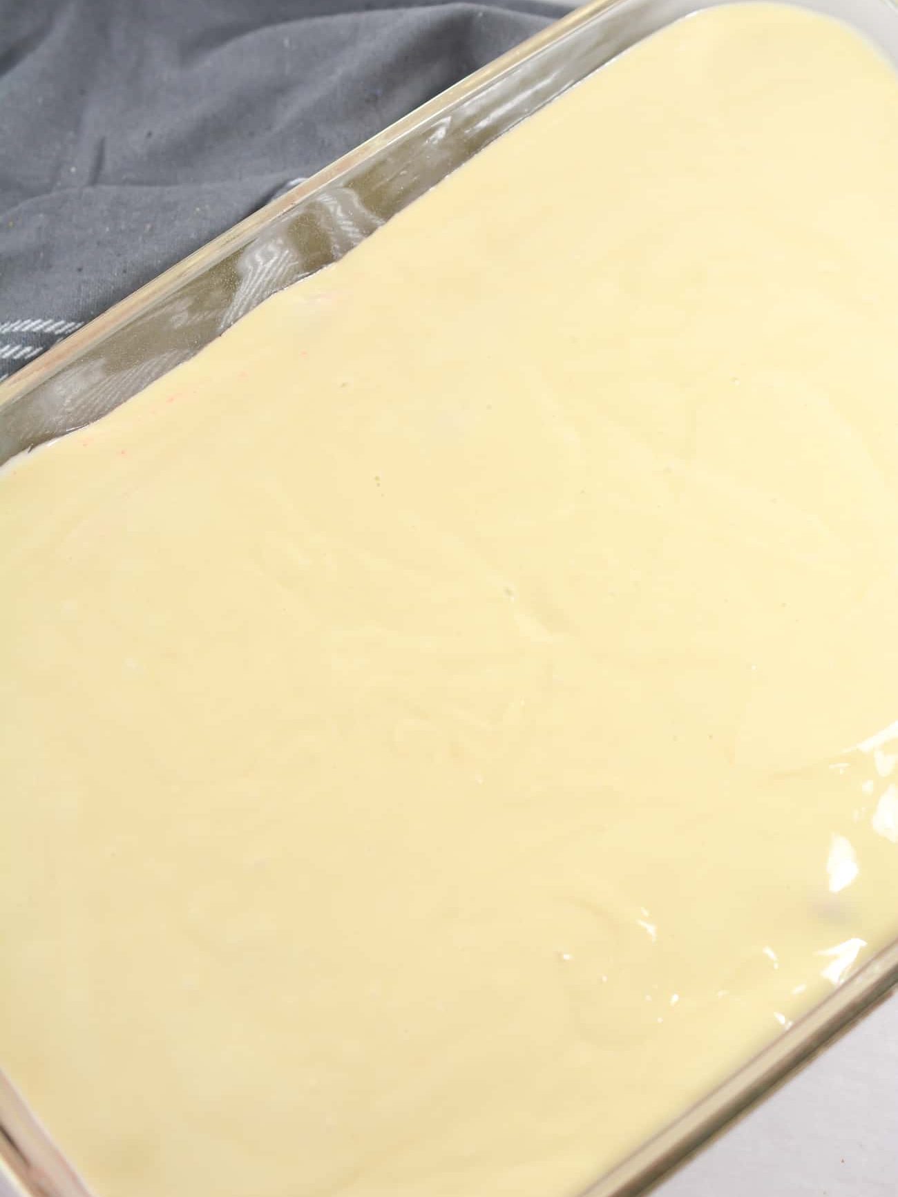 Spread a layer of the batter over the blueberries.