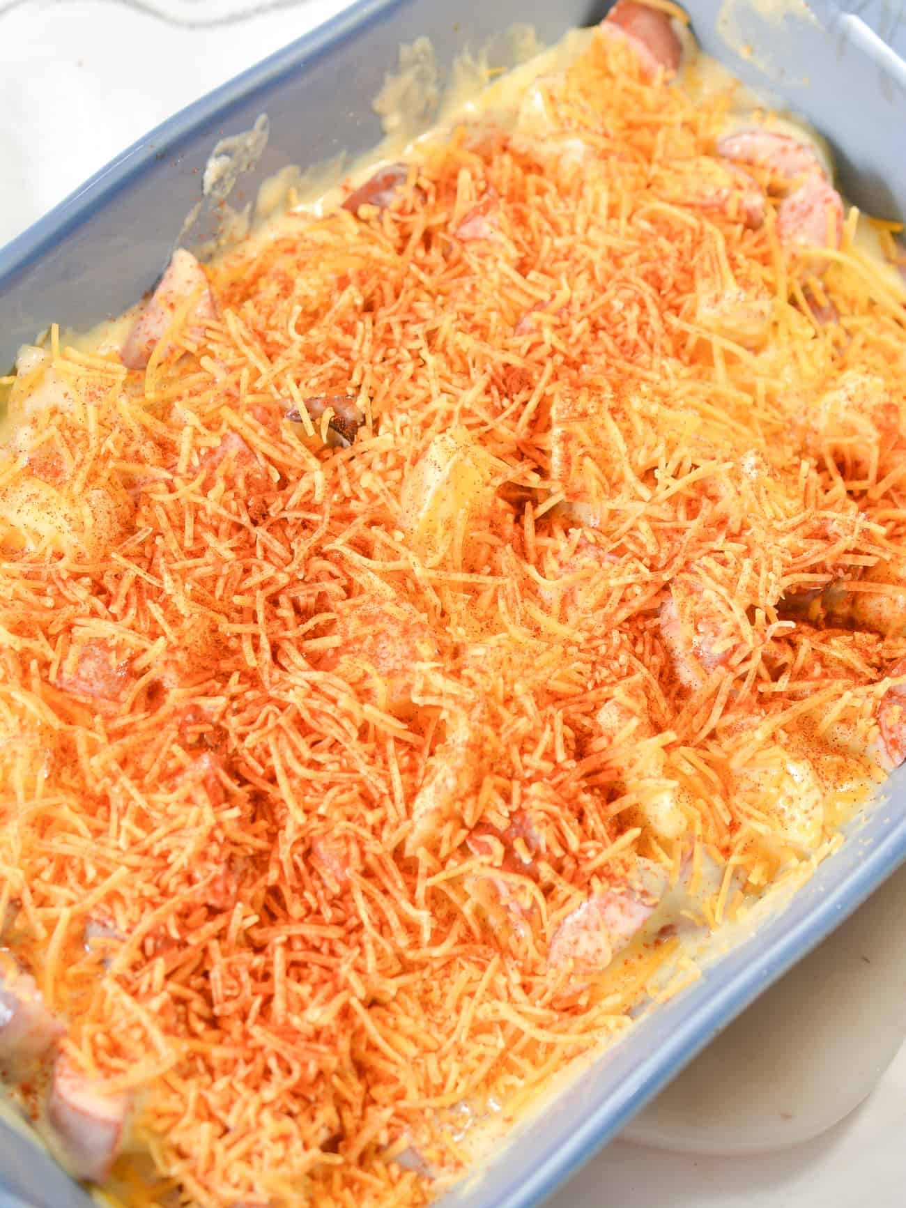 Sprinkle the cheddar cheese and paprika on top.
