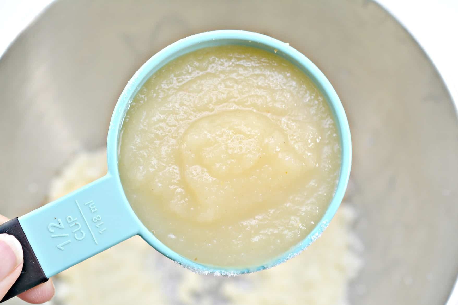 Add ½ cup of applesauce and 2 tsp vanilla to the mixing bowl.