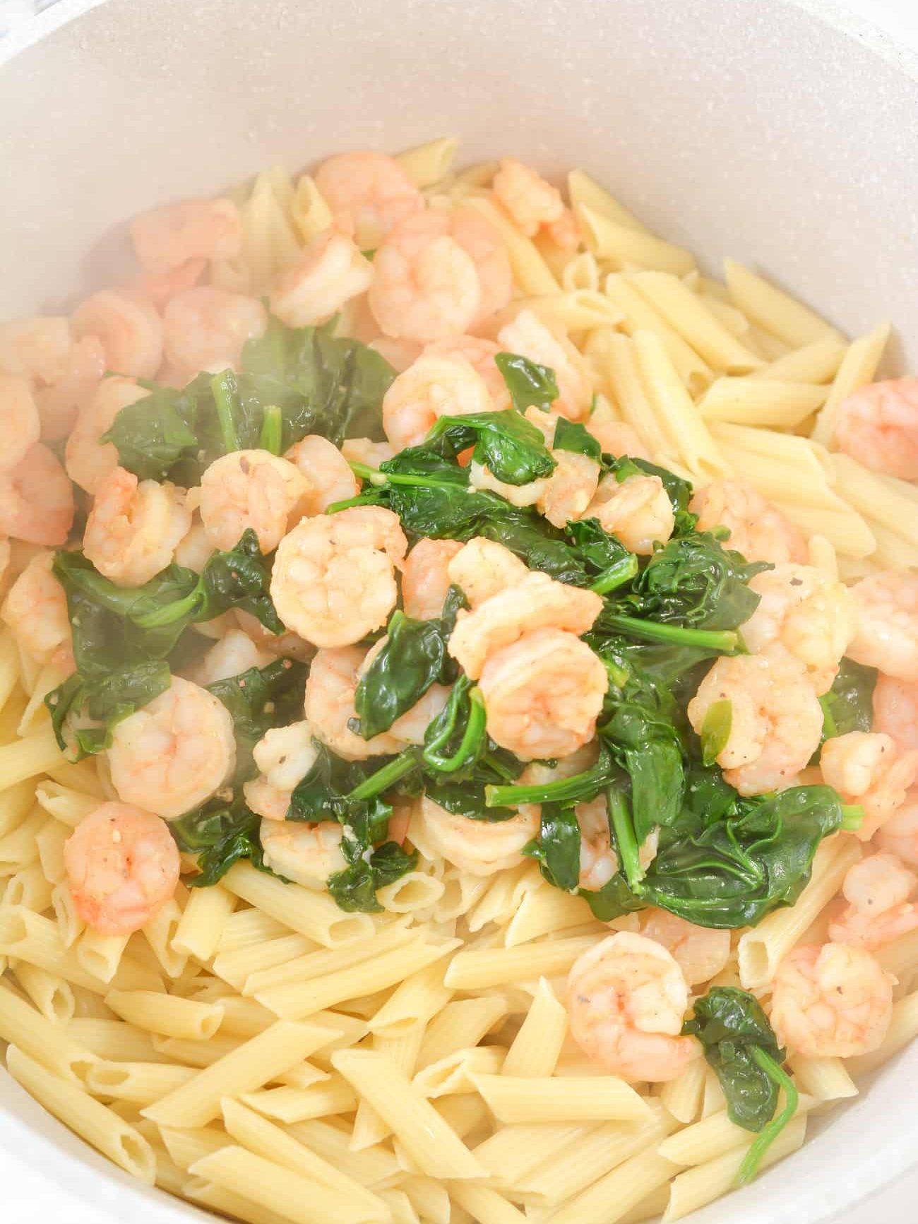 Pour the shrimp into a pot or serving dish with the pasta.
