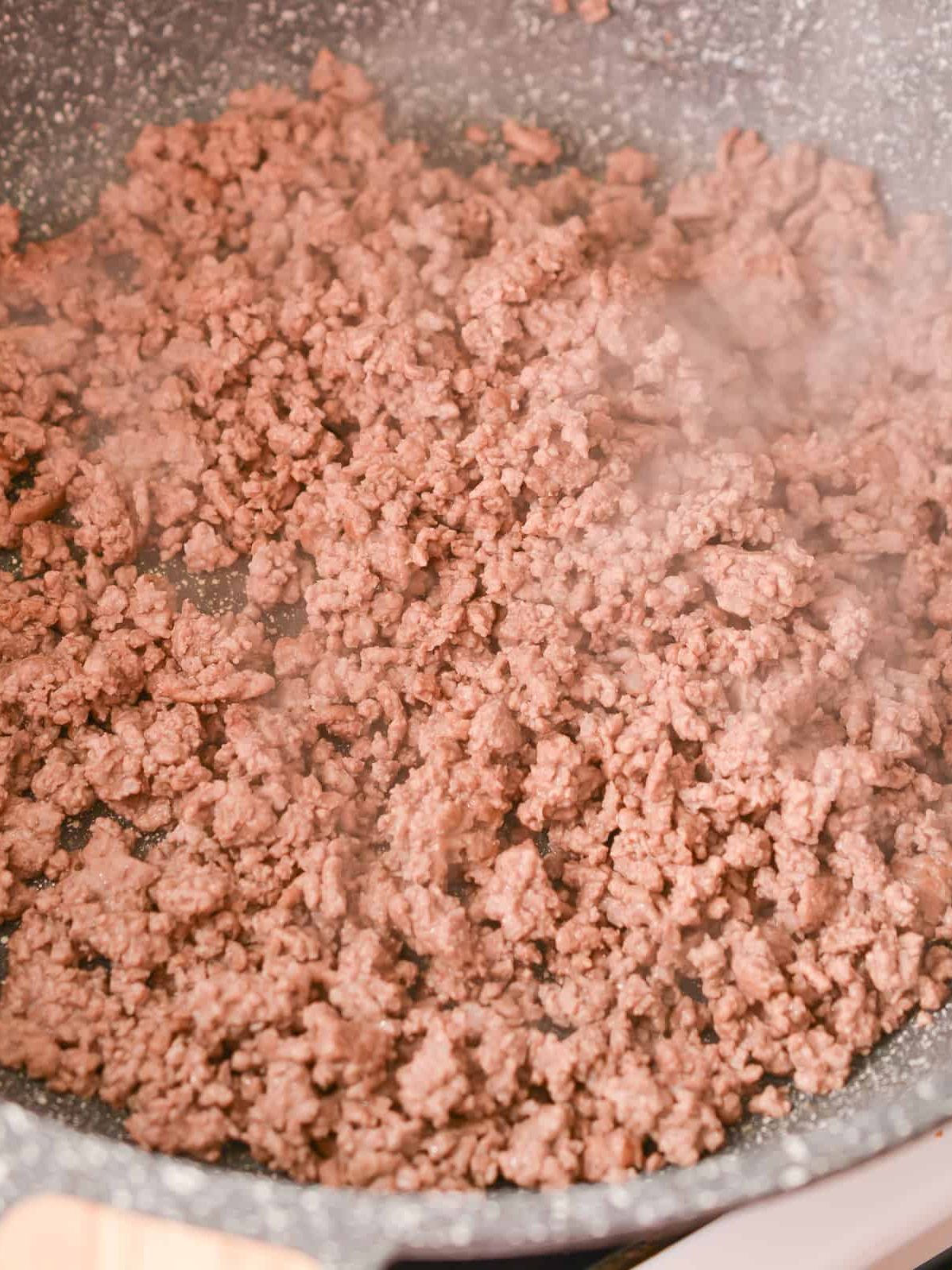 Cook the ground beef over medium-high heat until completely browned. Drain any excess grease.