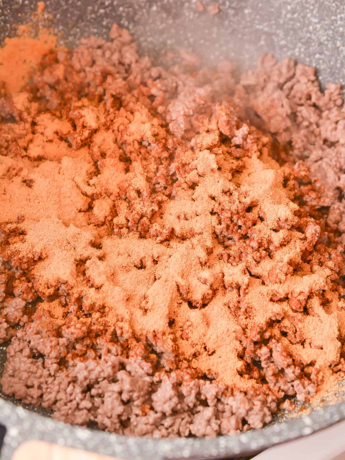 Stir the taco seasoning into the meat and set aside.