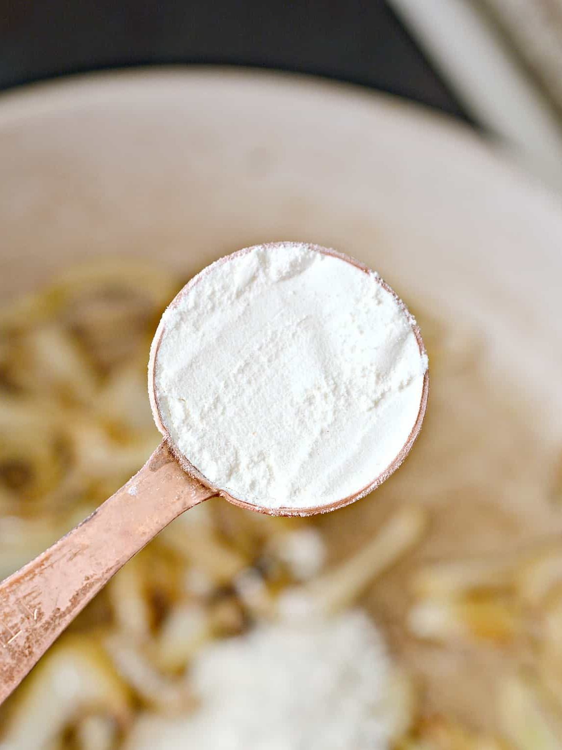 Stir the flour in with the onions and saute for another 30 seconds.