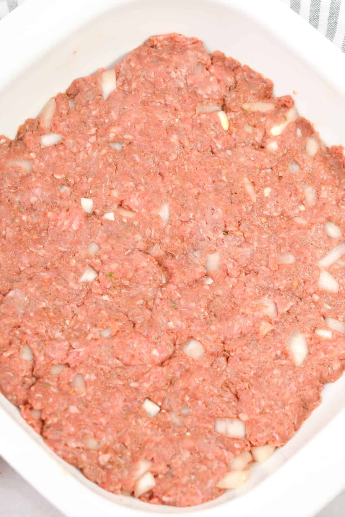 Press the meat mixture into a 9x9 well-greased baking dish.