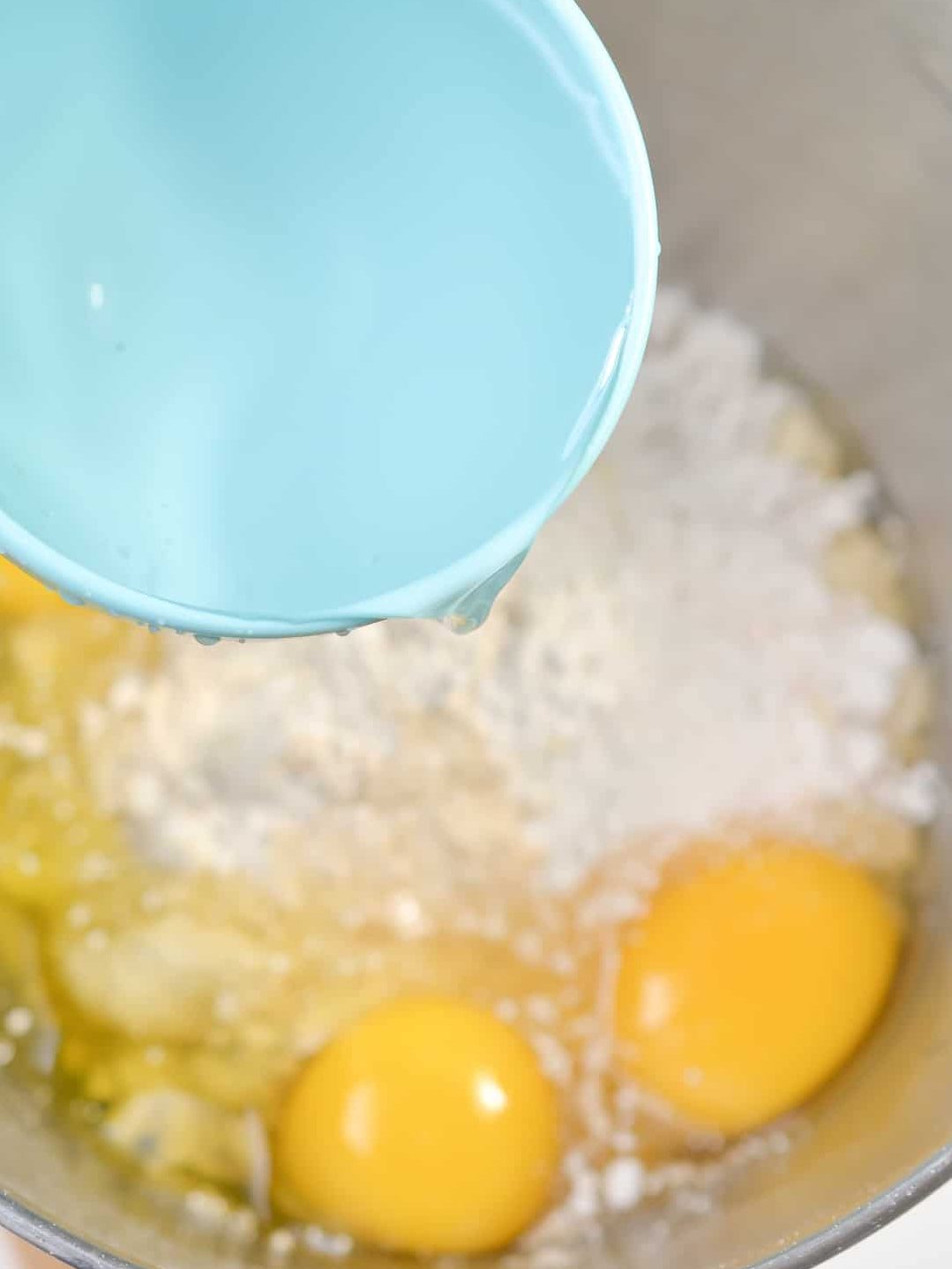 In a mixing bowl, combine the cake mix, eggs, and water.