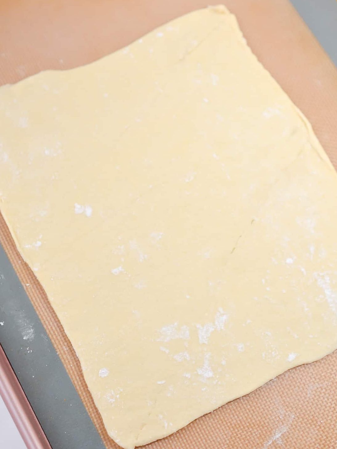 Roll half of the dough out until it is a rectangle about 12 inches long.