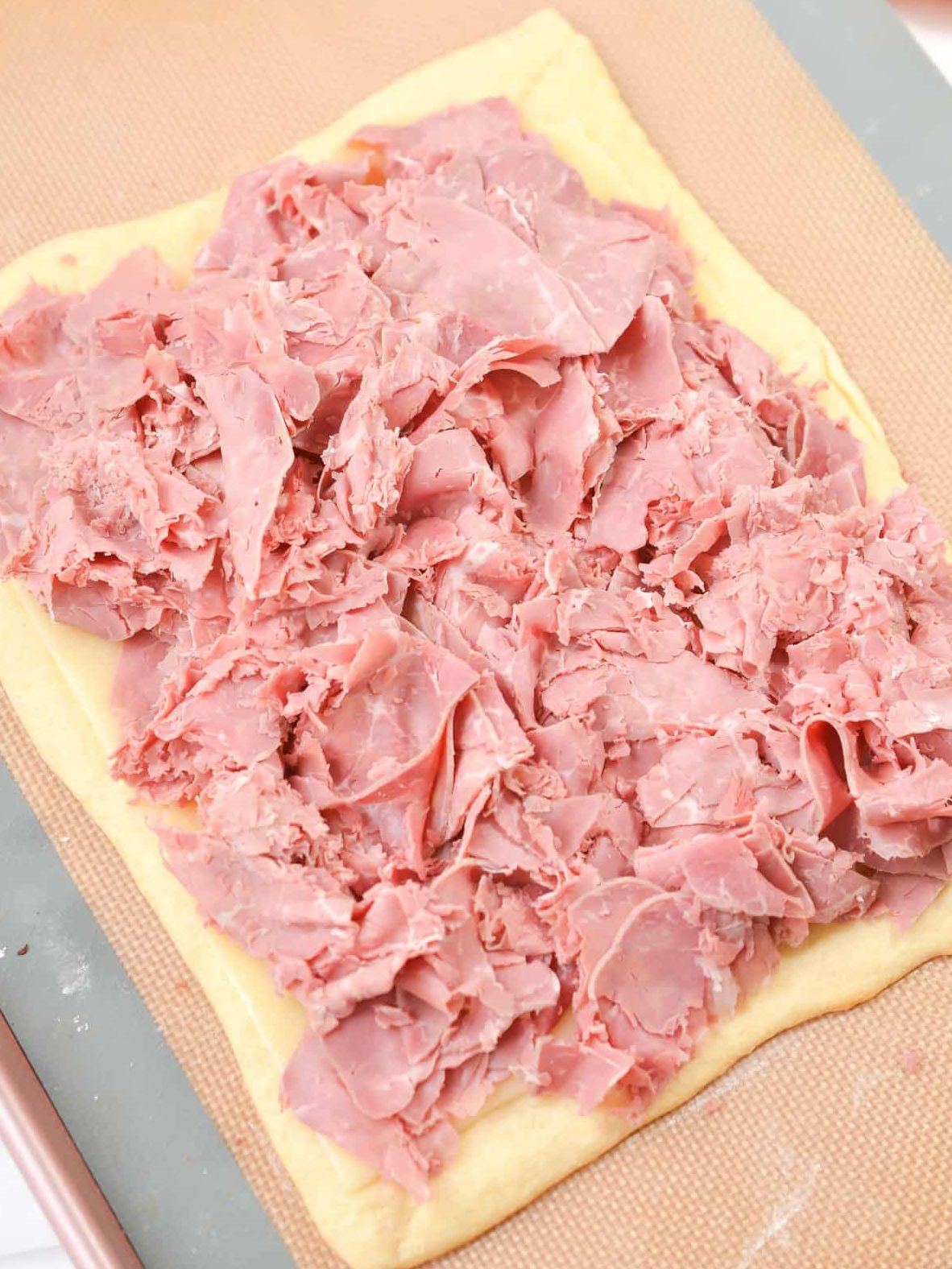 Place the corned beef on top of the swiss cheese.
