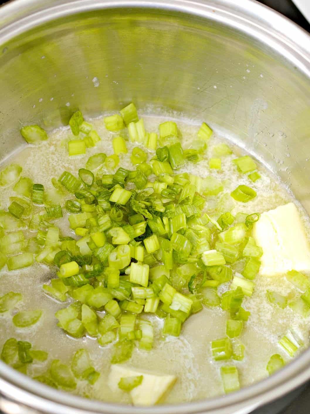 Add the celery and green onions to the saucepan, and saute until beginning to soften.