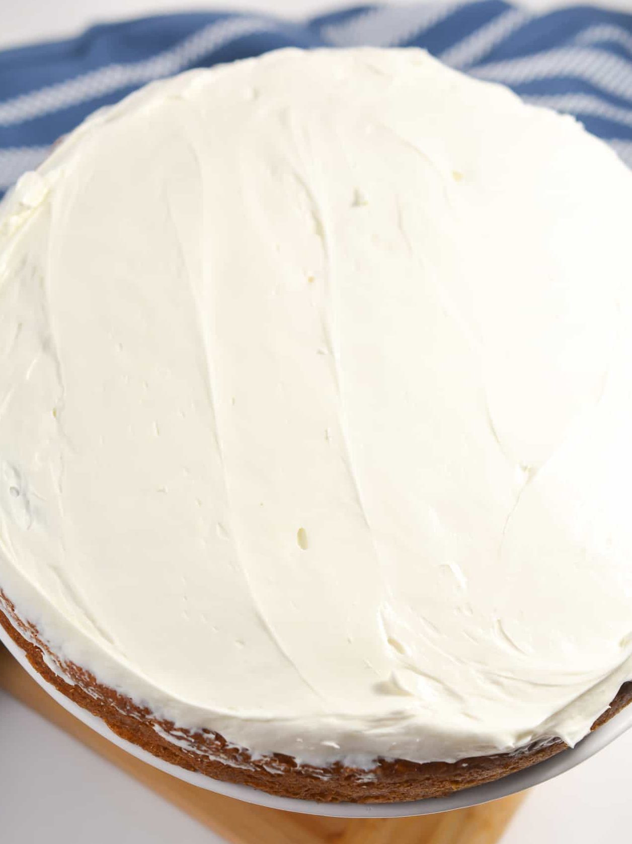 Place a layer of cake onto a tray or serving dish, then top with a layer of the frosting.