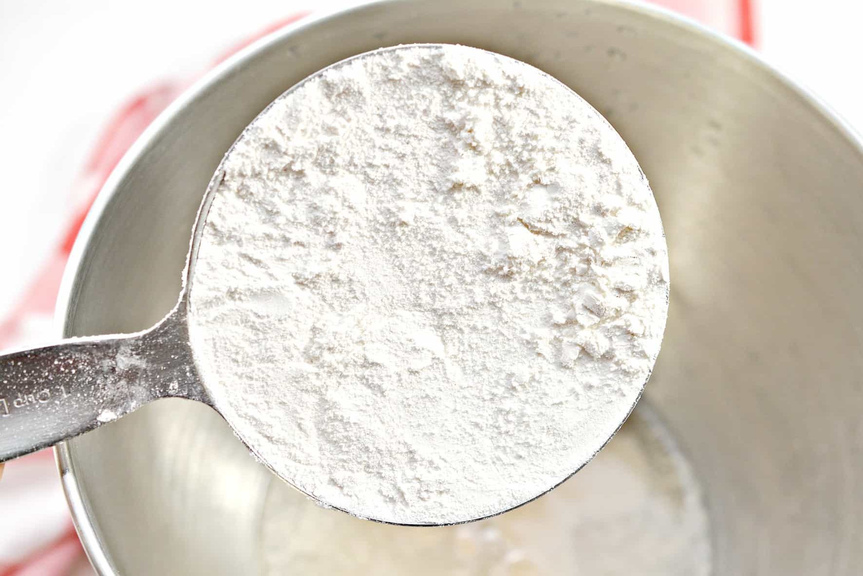 Place 2 cups of flour into the mixing bowl with the yeast mixture.