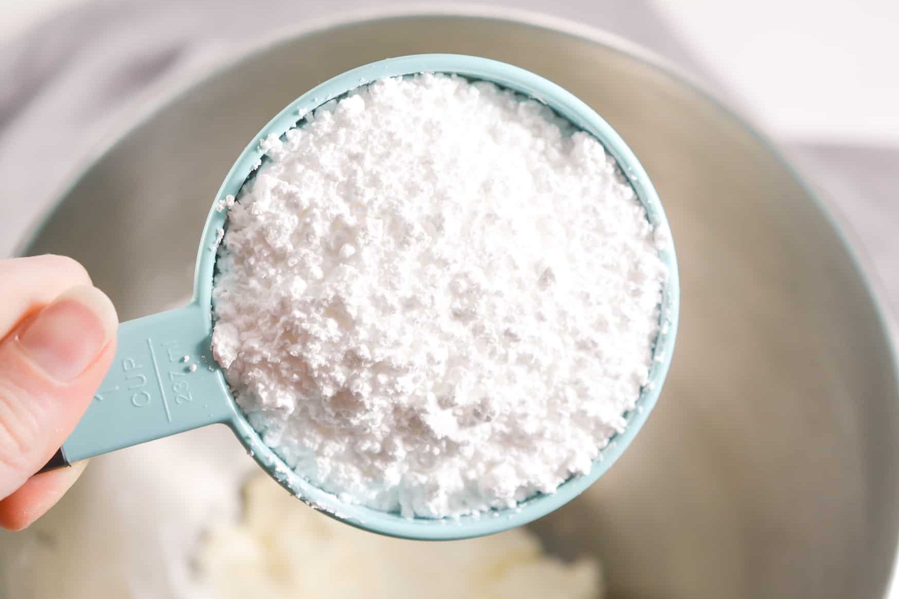 In a mixing bowl, beat together the cream cheese and powdered sugar until smooth.