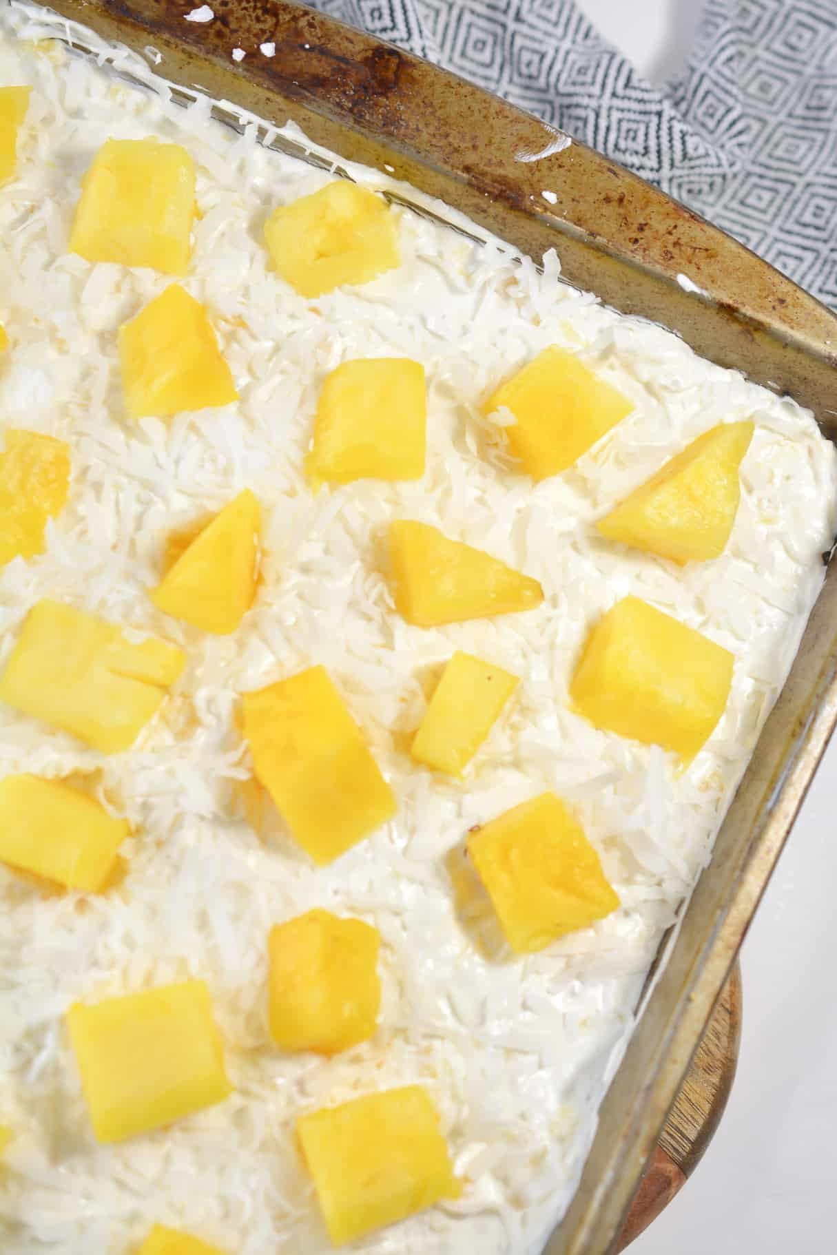 Top with shredded coconut and pineapple chunks for garnish.