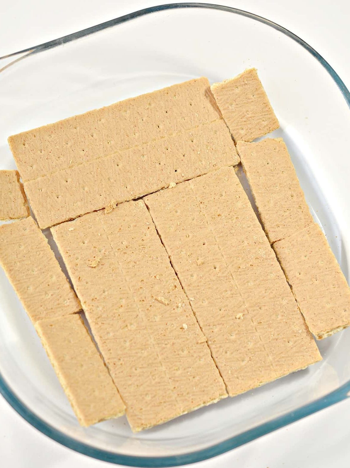 Place a layer of graham crackers in the bottom of a 9x9 baking dish. You can break the graham crackers up as needed to line it completely.