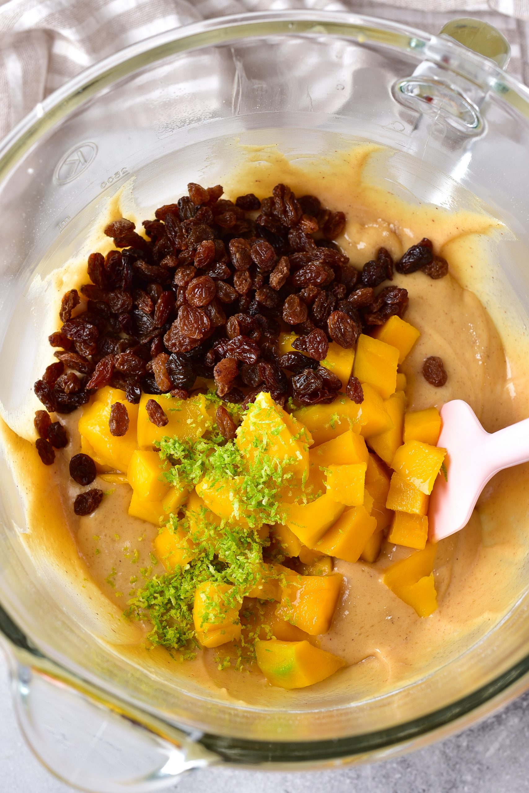 Fold in the mango, raisins, and zest.