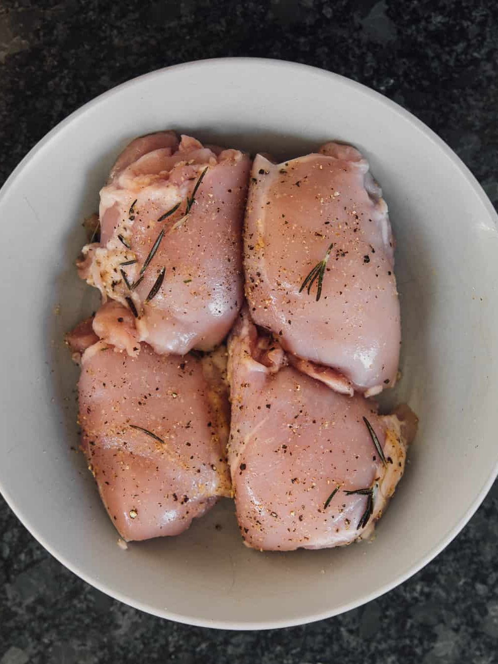 Pat your chicken thighs with a paper towel to remove any moisture and trim off excess fat.