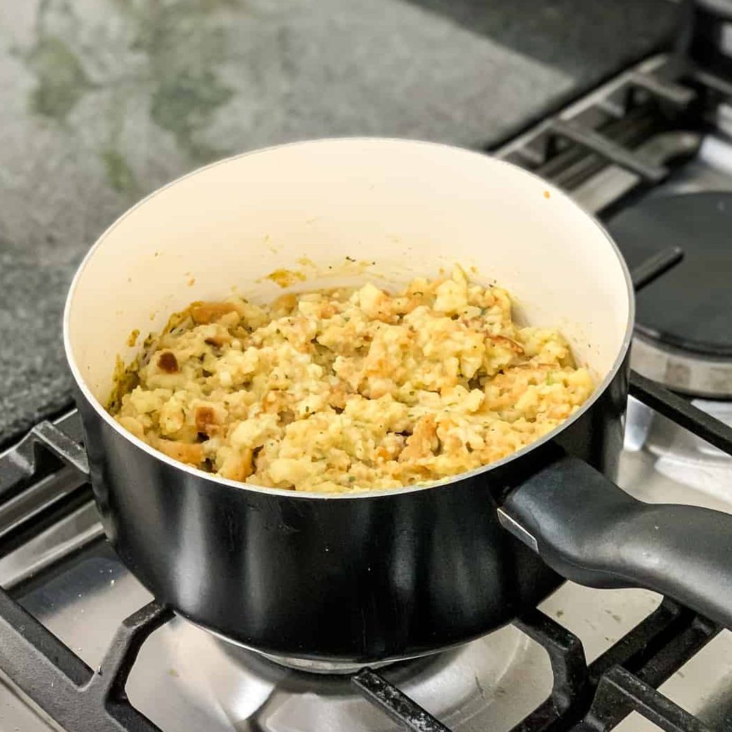 Remove saucepan from heat, cover, and let sit until water is absorbed (5 minutes). Stir the stuffing mix with a fork.