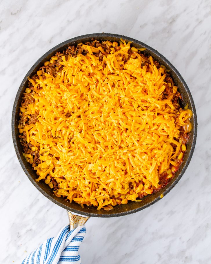 Sprinkle the cheese on top and cover again.