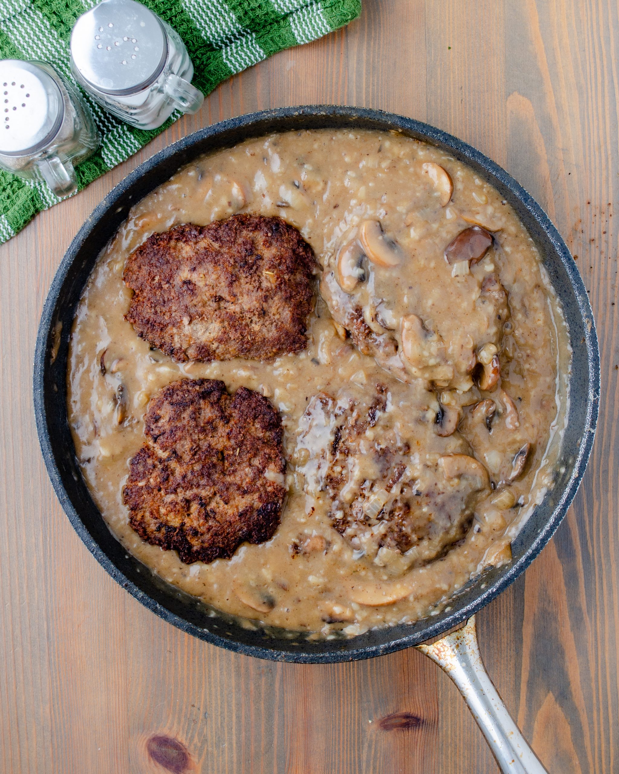 Place the Salisbury steak patties back in the pan with the gravy and cook for about 5 to 10 minutes.