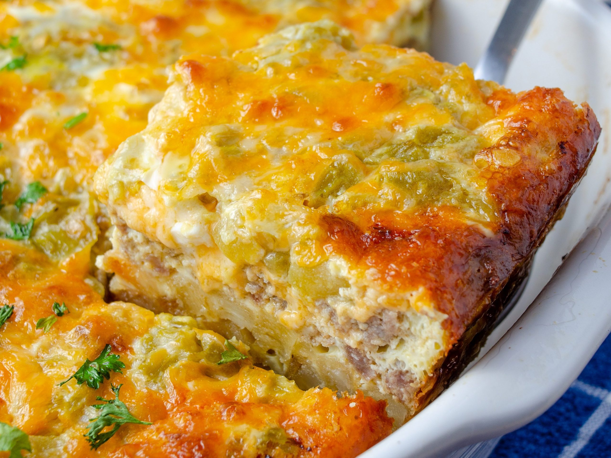 https://sweetpeaskitchen.com/wp-content/uploads/2022/08/Sausage-Hashbrown-Casserole-5-edited-scaled.jpg