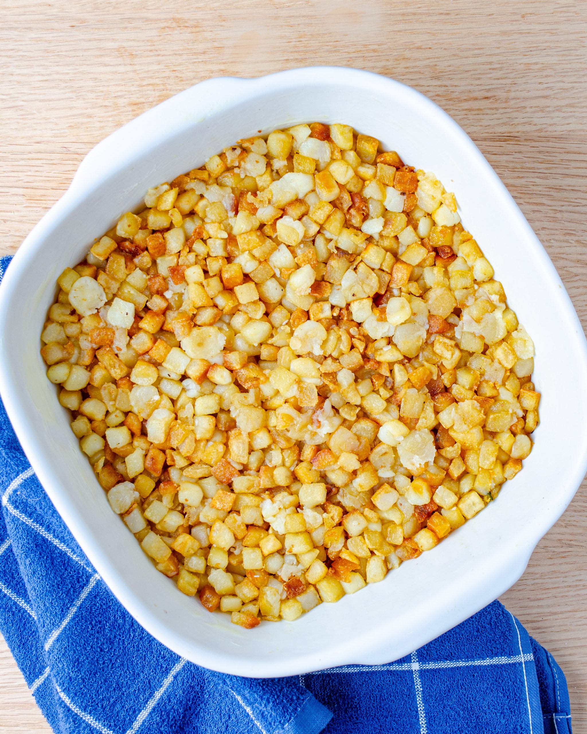 Layer the hashbrowns on the bottom of a 9x13 greased casserole dish.