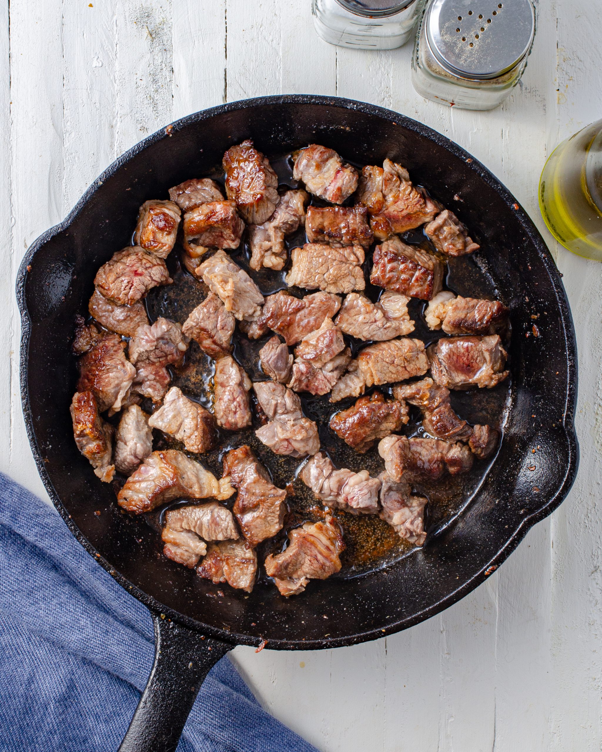 Add oil to a pan, when the oil is nice and hot add steak bites. Season with salt and pepper.