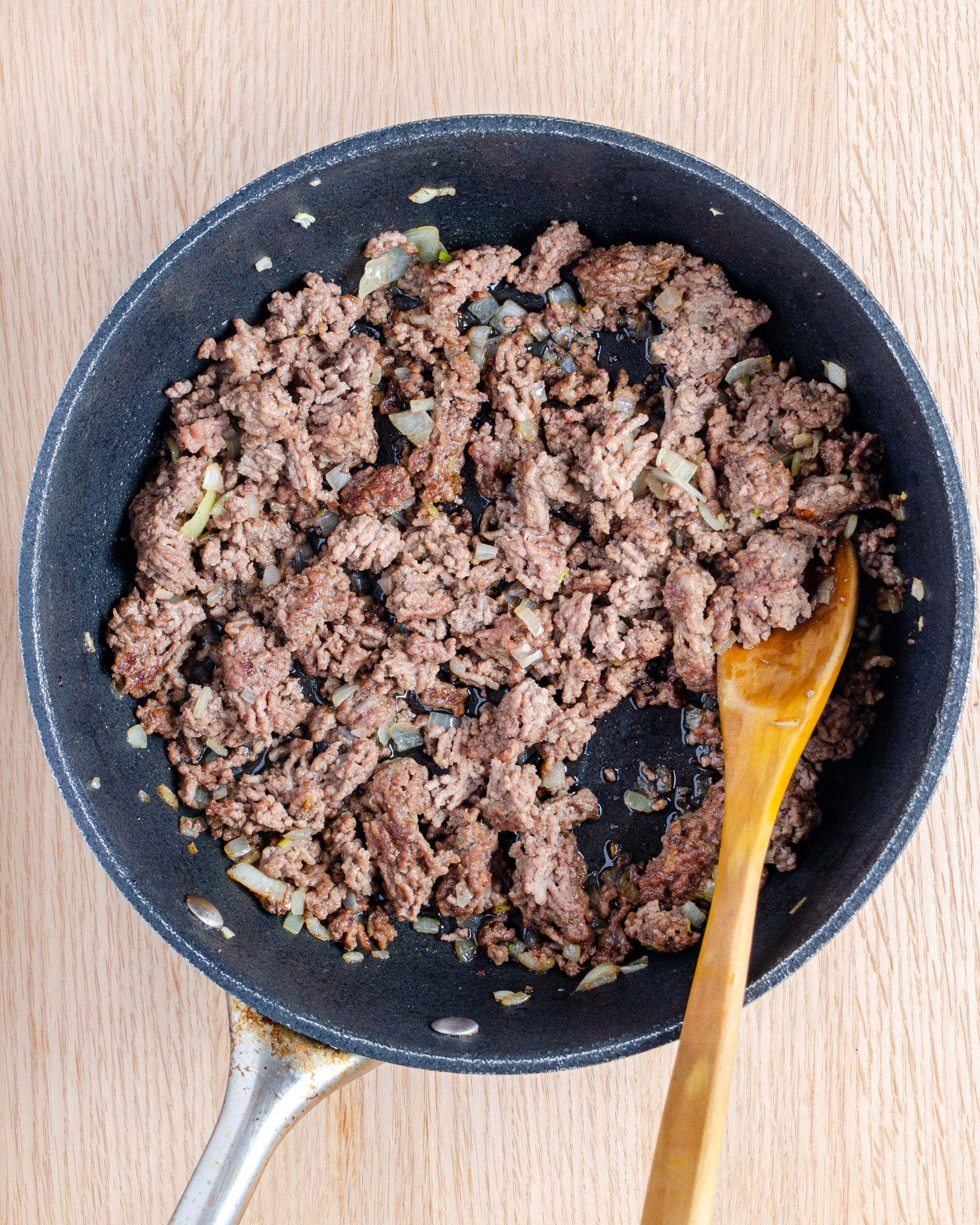 Add the ground beef and onion to a skillet over medium-high heat on the stove, and cook until the meat is browned and onions have softened. Drain any excess grease.